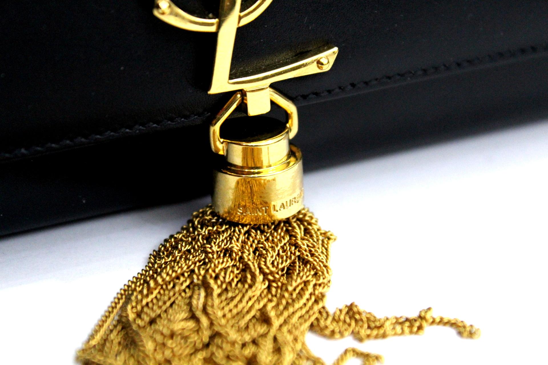 Monogram Saint Laurent with YSL logo braided in metal and chain with metal nappin. Gold Hardware