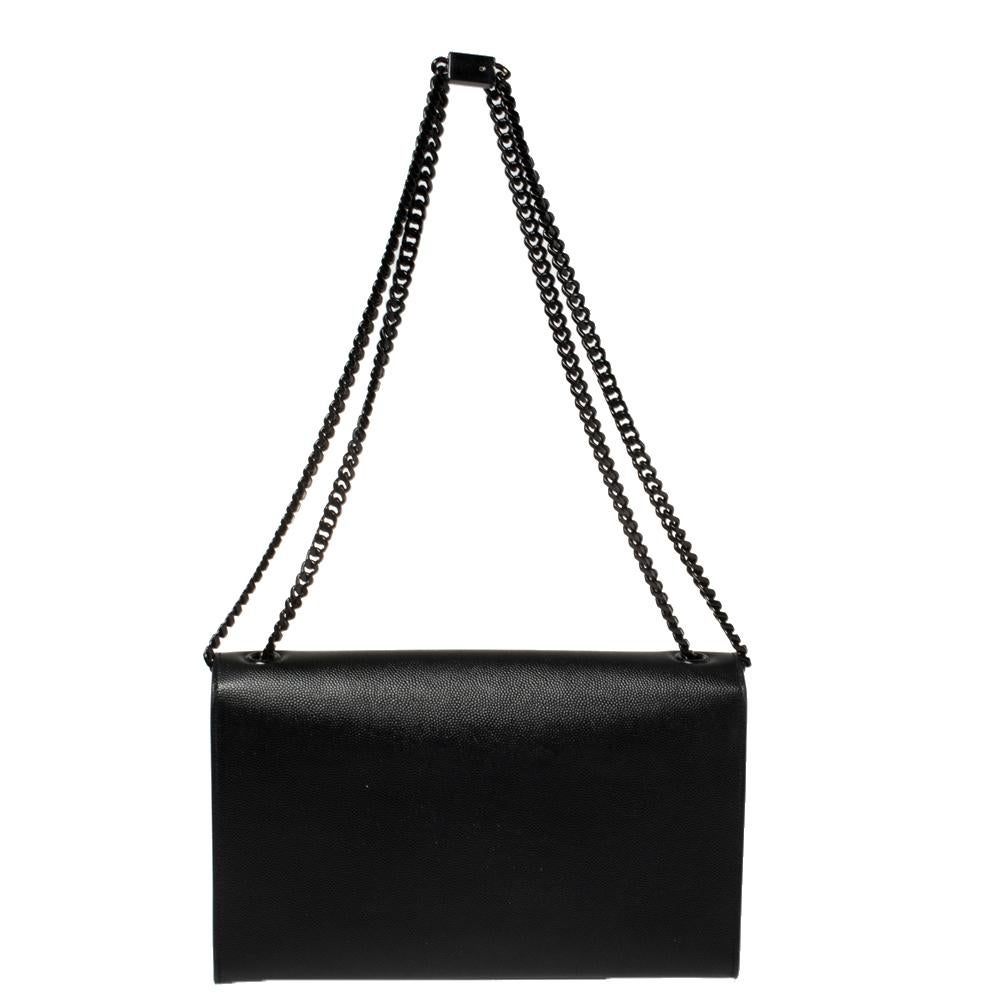 Meticulously crafted from durable leather, this Saint Laurent Kate shoulder bag exudes just the right amount of sophistication. The bag features a sturdy silver-tone shoulder chain, the YSL logo on the front flap, and a fabric-lined compartment to