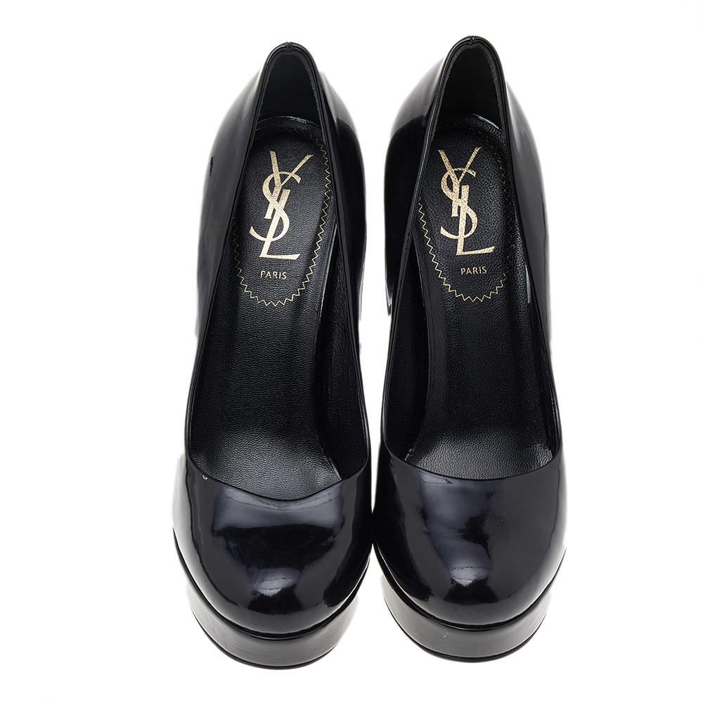 There are some shoes that stand the test of time and fashion cycles, these timeless Saint Laurent pumps are the one. Crafted from patent leather in a black shade, they are designed with sleek cuts, round-toes, and tall heels supported by platforms.

