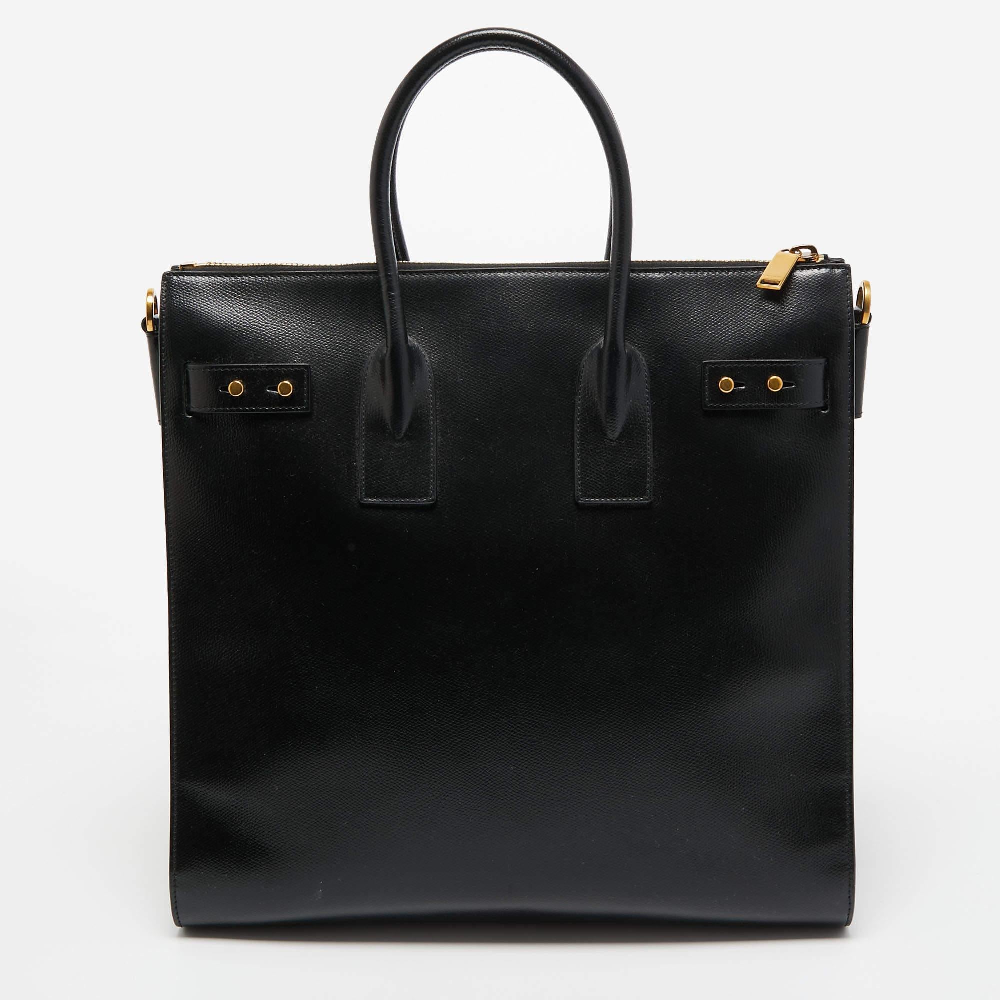 This Saint Laurent tote is an example of the brand's fine designs that are skillfully crafted to project a classic charm. It is a functional creation with an elevating appeal.

Includes: Original Dustbag, Detachable Strap, Info Booklet, Lock and