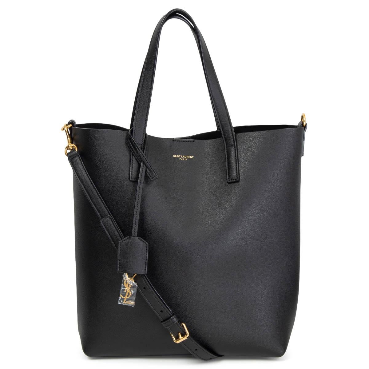 100% authentic Saint Laurent Shopping Toy Tote Bag in black leather featuring gold-tone hardware.Comes with a logo charm and a detachable shoulder-strap. Unlined. Brand new. Comes with dust bag. 

Measurements
Height	27cm (10.5in)
Width	24cm