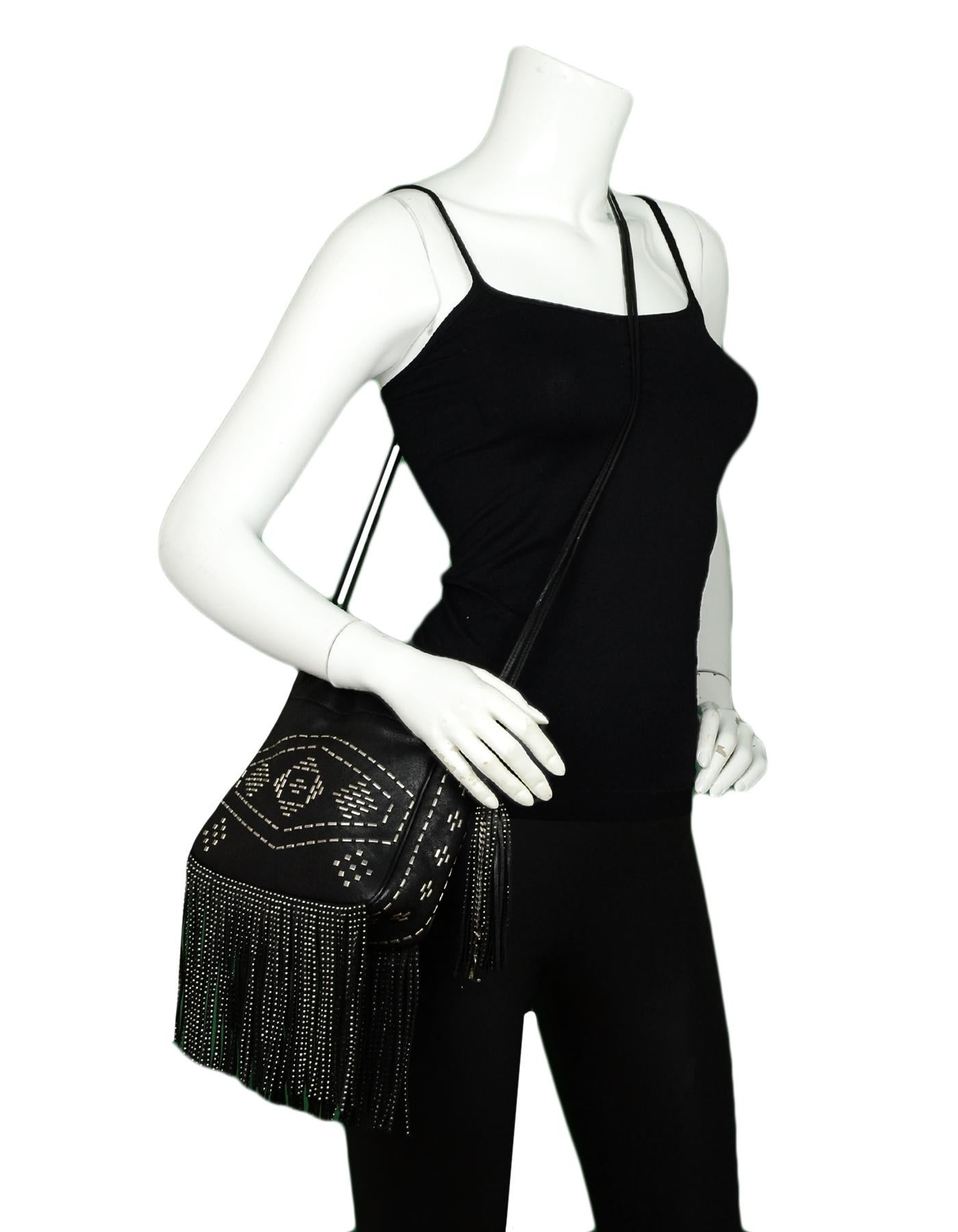 Saint Laurent Black Silver Leather Small Helena Fringed Bucket Bag w. Oxidized Nickle Studding

Made In: Italy 
Color: Black
Hardware: Silvertone
Materials: Leather and oxidized nickle
Lining: Black fine textile
Closure/Opening: Open top with