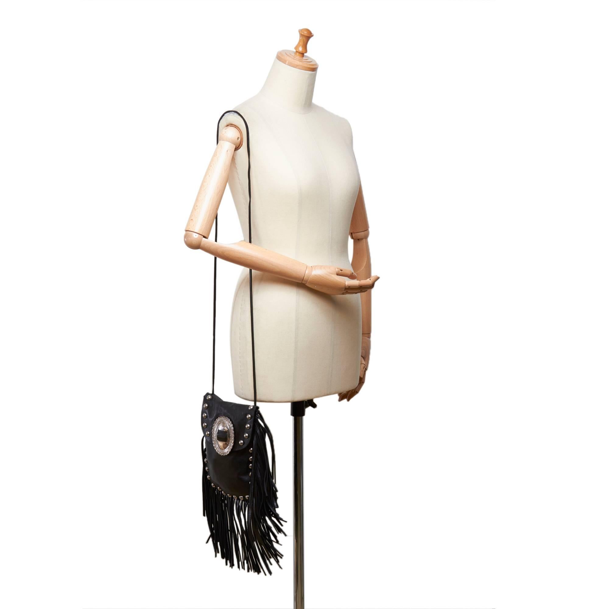 - Saint Laurent black leather silver-toned studded with leather fringe shoulder bag. The bag name is called 