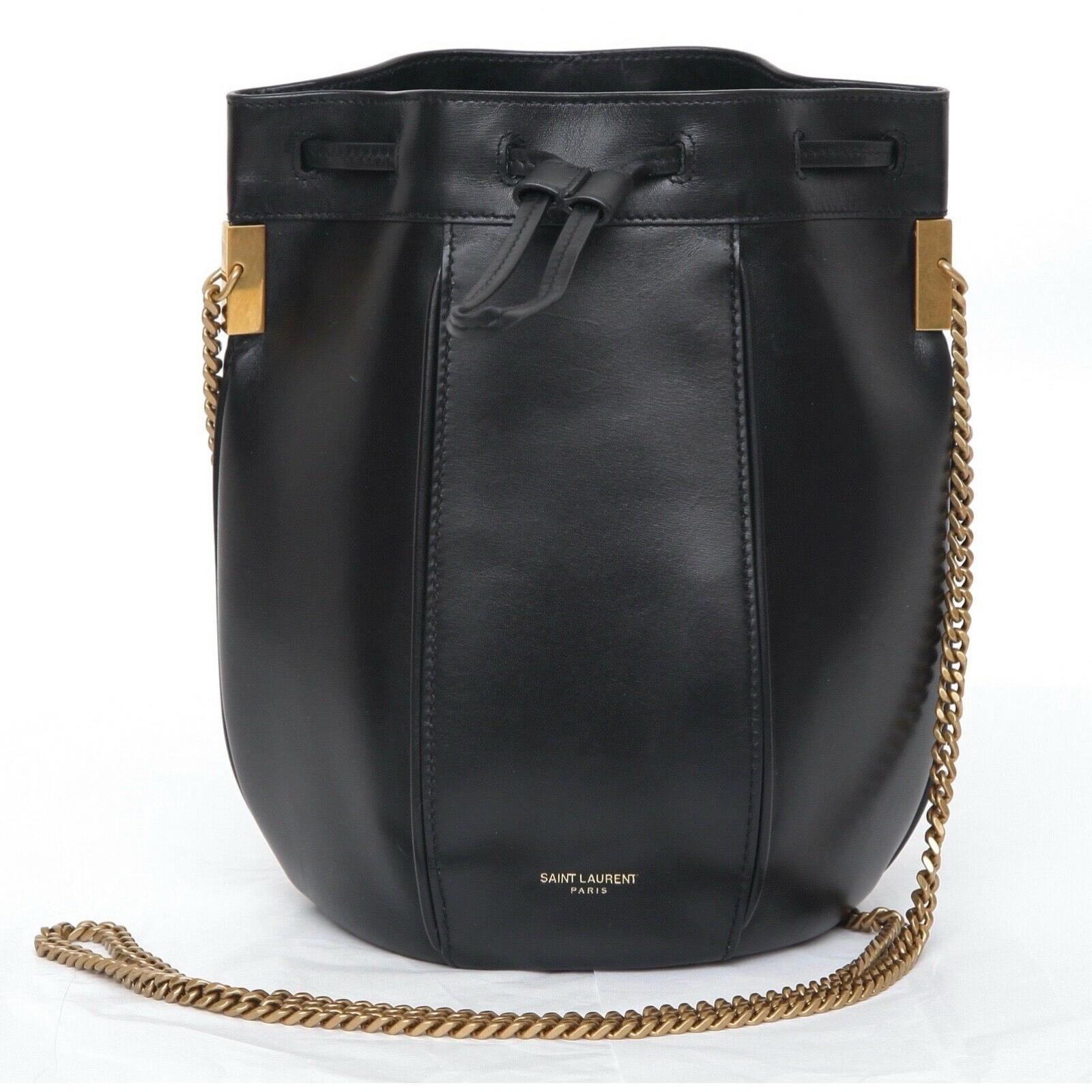 GUARANTEED AUTHENTIC SAINT LAURENT SMALL TALITHA BUCKET BAG

Retails excluding sales tax $1,950

Design: 
- Black leather exterior.
- Panels.
- Front drawstring closure.
- Signature embossed at bottom front.
- Interior has one main compartment with
