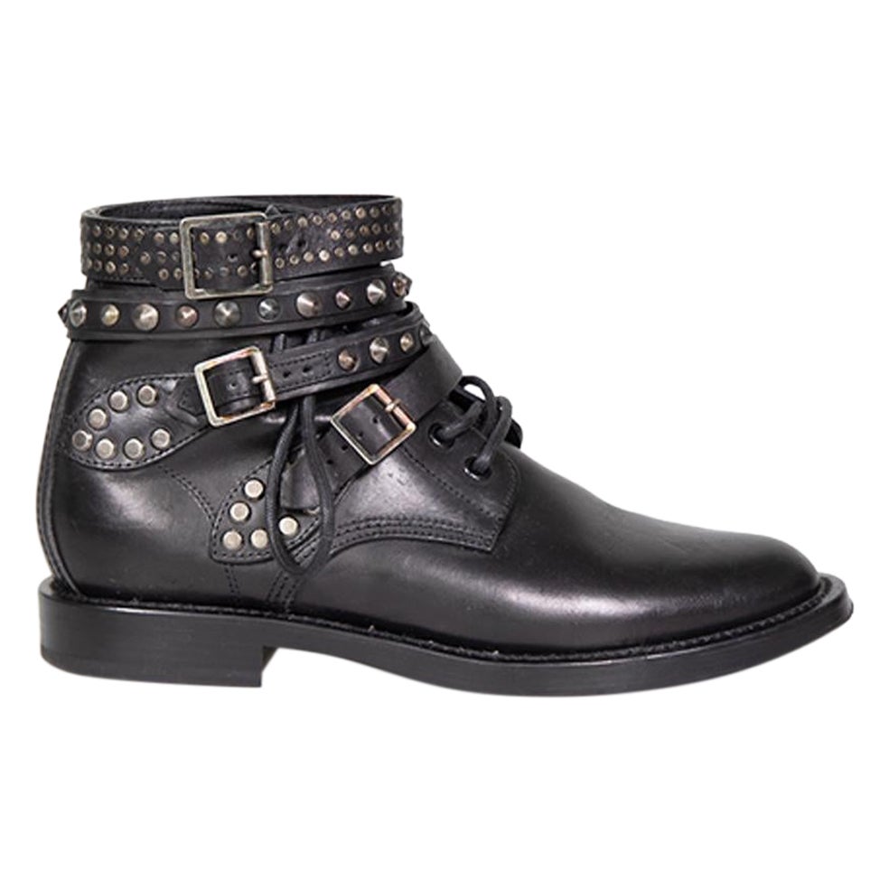 Saint Laurent Botines de piel negra con tachuelas y cinturón Talla IT 38 en venta