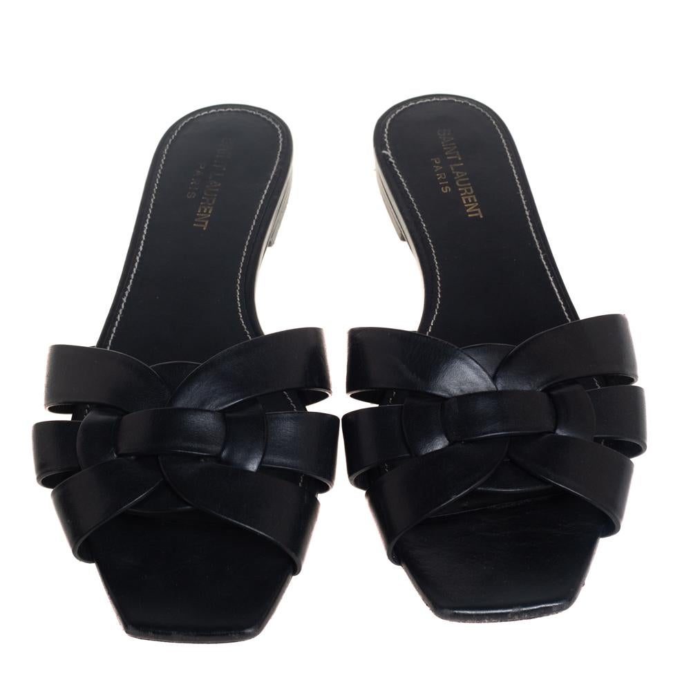 One of the most sought-after designs from Saint Laurent is their Tribute style. They are such a craze amongst fashionistas around the world, and it is time you own one yourself. These black slide flats are designed with leather straps and a backless