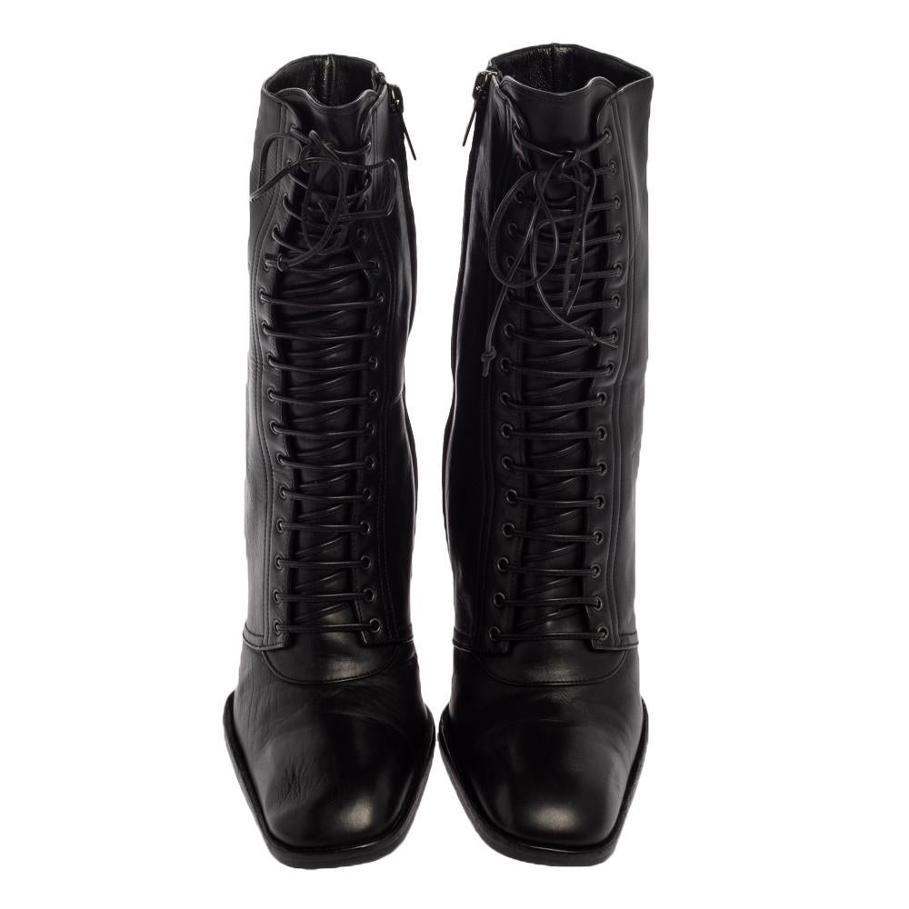 Saint Laurent elevates your style quotient giving you just the right amount of attention with this amazing pair of black boots. These fabulous leather boots make for comfortable wear. They are styled with square toes, lace-ups on the vamps, side