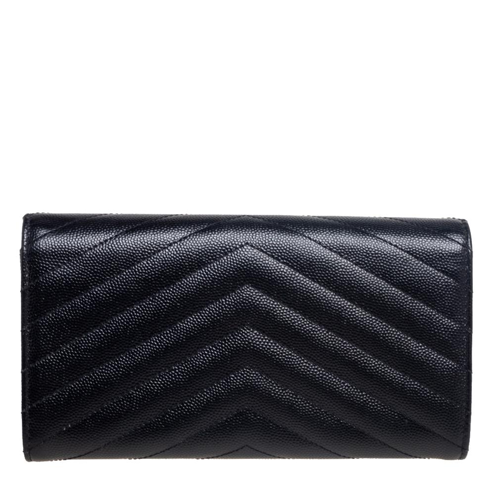 Saint Laurent's envelope wallet is equipped with multiple slots and compartments to neatly house essentials. It features a black matelassé leather body, detailed with the signature 'YSL' logo in gold-tone on the flap. The sleek style looks good