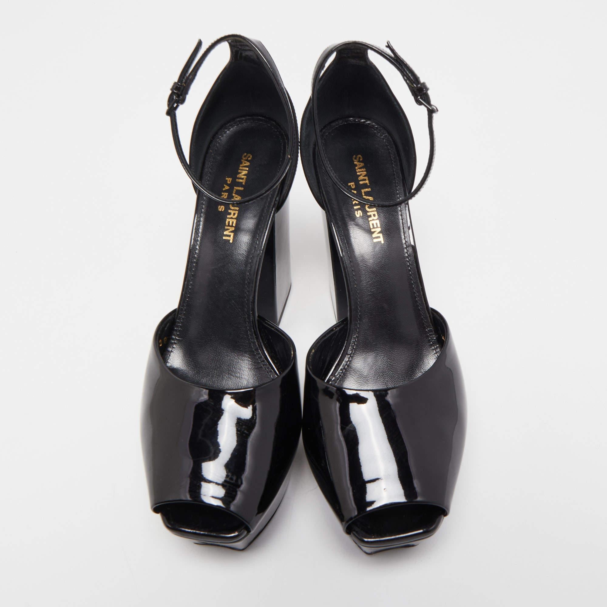 The Saint Laurent Jodie sandals are stylish and bold footwear. They feature a black color, chunky platform soles for added height, and a sleek design that exudes modern elegance. These sandals are perfect for making a fashion statement while