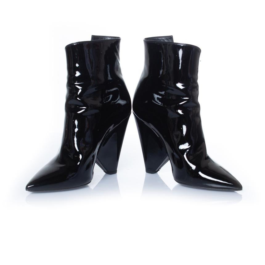 Saint Laurent, Black patent leather niki boots. The item has been worn once and is in very good condition. Comes with dustbags and box.

• CONDITION: very good condition 

• SIZE: 36

• INSOLE MEASUREMENTS: 22 cm

• HEEL MEASUREMENTS: 10 cm