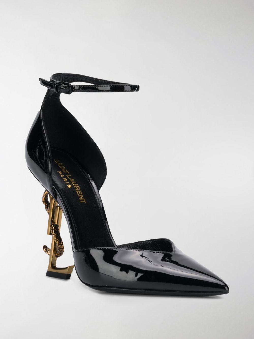 Saint Laurent Black Patent Leather Opyum D'Orsay YSL Logo Heel Pump

Saint Laurent douses footwear with a liberal dose of rebellion. Classic pointy pumps are sharpened via architectural sculpting, patent finishes lend new luster, and the inimitable