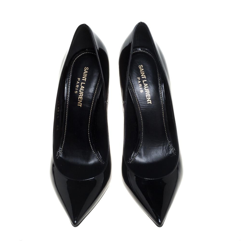 These Saint Laurent pumps are timeless. They are crafted from black patent leather and styled with pointed toes and 'YSL' logo shaped heels. They come equipped with comfortable leather-lined insoles and will look great with a lot of your