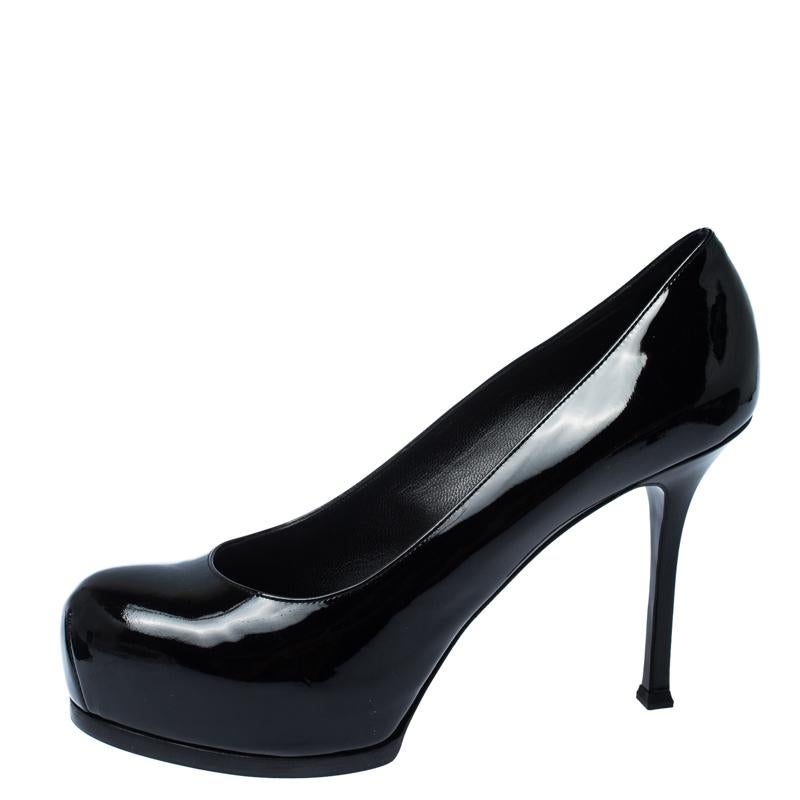 Fashionable and chic, these Tribtoo pumps from Saint Laurent will cut an alluring silhouette from day to night. Crafted from patent leather, the pumps have a black shade, concealed platforms, and 11 cm heels.

Includes: The Luxury Closet Packaging,
