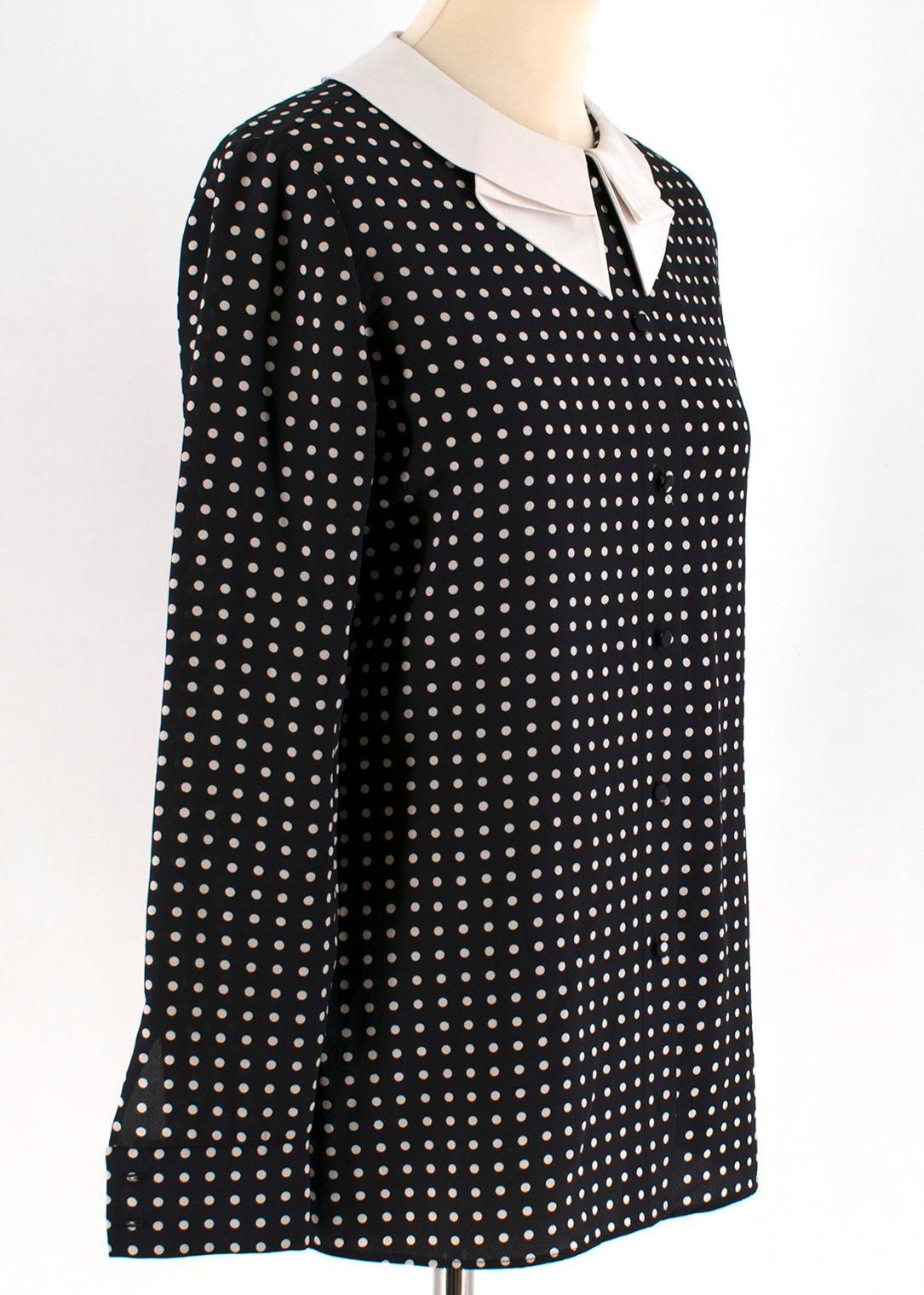 Saint Laurent Black Polka Dot Silk Shirt

- black silk shirt
- white polka dot pattern 
- white collar
- button fastening
- lightweight

This seller usually wear size XS.

Please note, these items are pre-owned and may show some signs of storage,