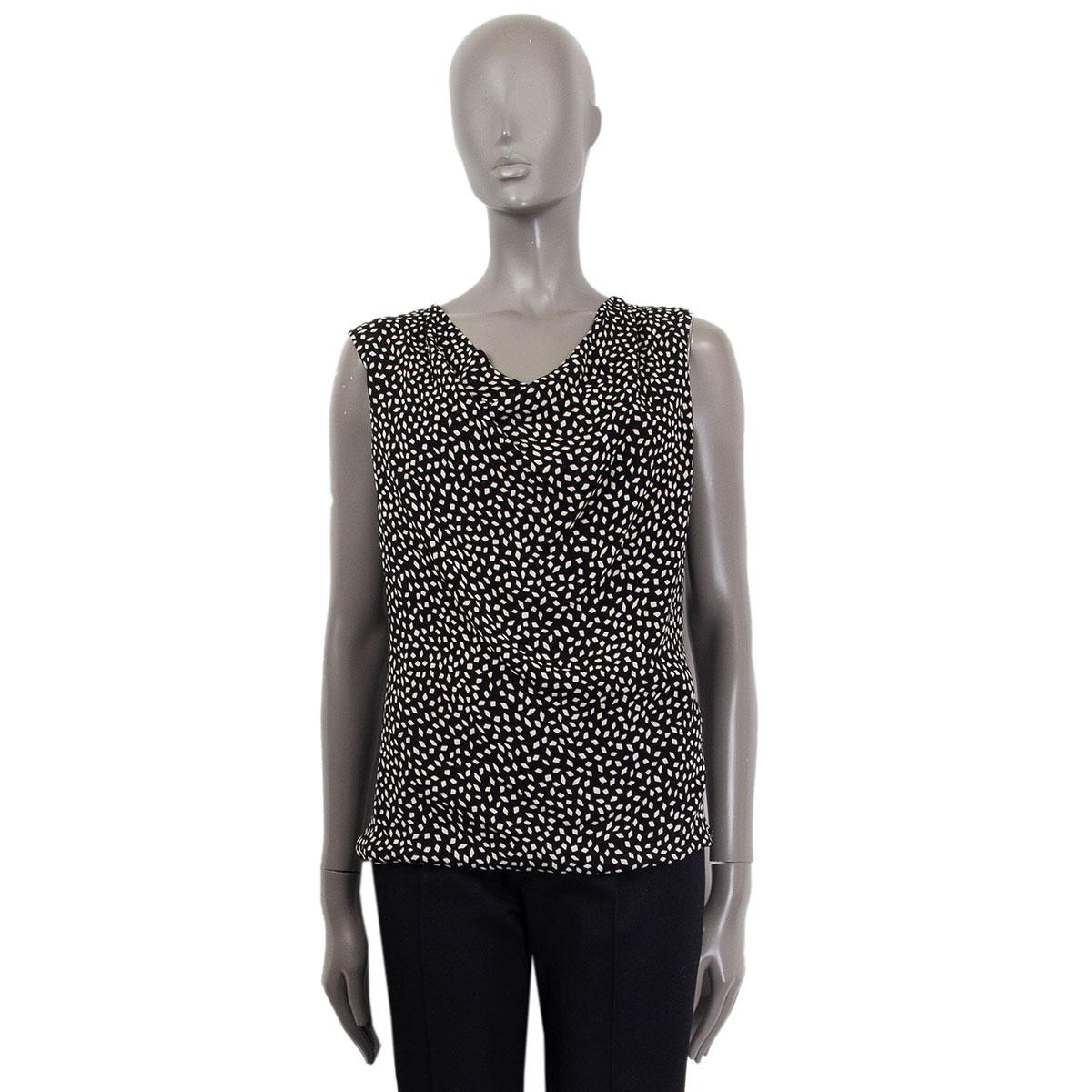 Saint Laurent sleeveless cowl neck top in black and off-white printed viscose (100%) and black silk (100%) lining. Opens with a zipper on the back. Has been worn and is in excellent condition.  

Tag Size 36 
Size XS
Shoulder Width 40cm
