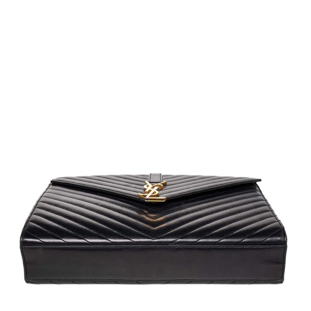 Fashioned using chevron-quilted leather into a structured silhouette, this Saint Laurent shoulder bag has high style and a timeless charm. It has a flap design and the front is highlighted with a gold-tone YSL logo. The interior is lined with