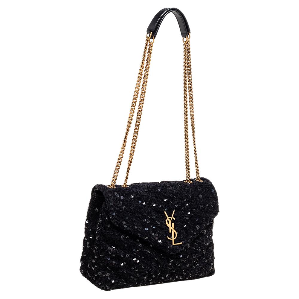 Covered in sequins, this Saint Laurent Loulou bag is a luxe piece to add to your collection this season. Lined with the finest fabric, this bag can easily hold all your essentials. It features the YSL logo in gold-tone metal on the front flap and a