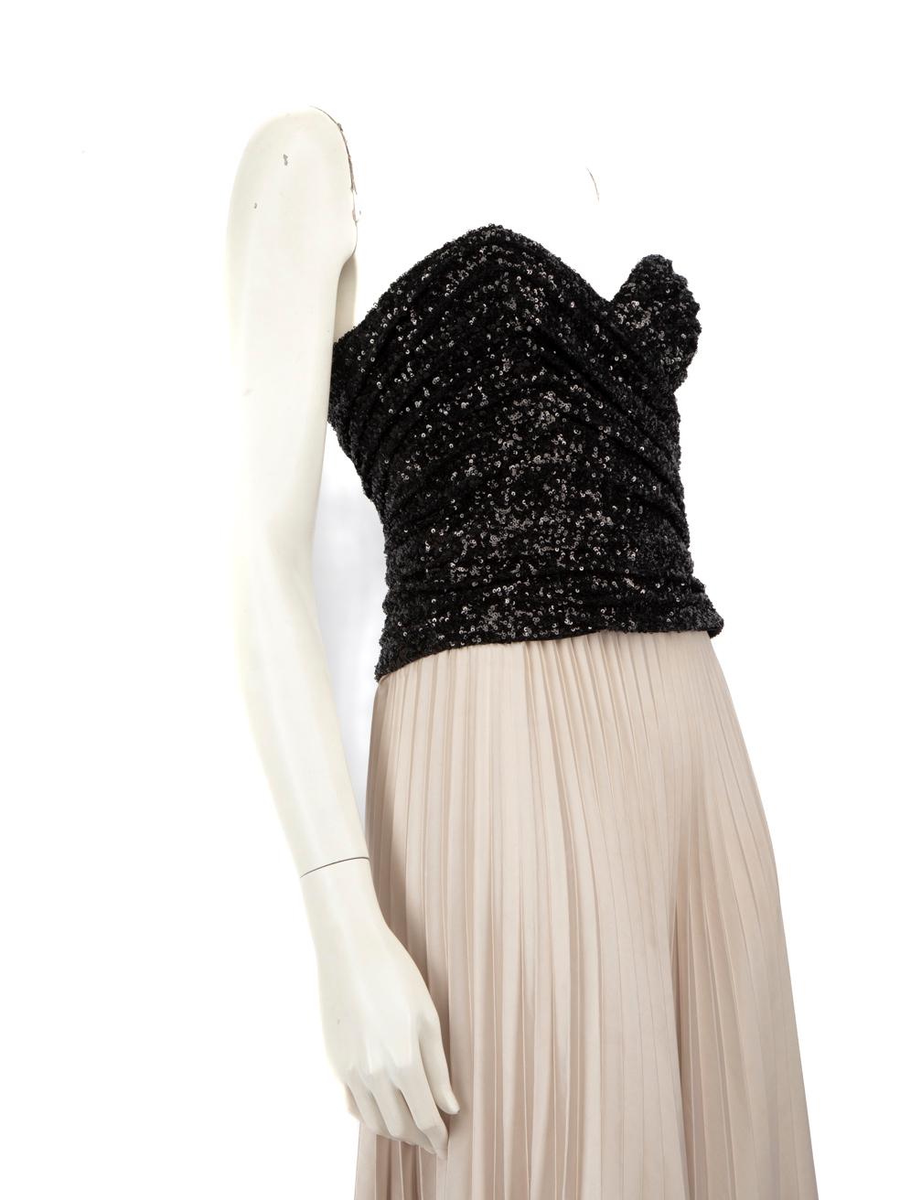 CONDITION is Very good. Hardly any visible wear to the top is evident on this used Saint Laurent designer resale item.
 
 Details
 Black
 Synthetic
 Bustier top
 Sequinned Mesh
 Strapless
 Side zip and hook fastening
 
 
 Made in France
 
