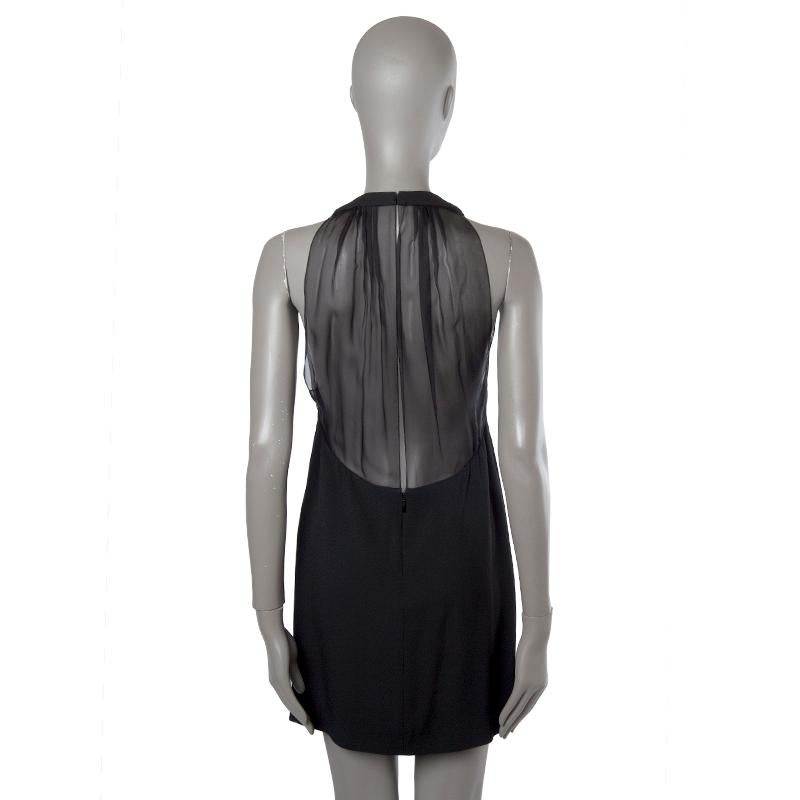 aint Laurent Pre-AW'13 mini dress in black acetate (57%) and viscose (43%). With gathered neck and sheer keyhole back. Closes with two hooks at the top and invisible zipper at the bottom of the back. Lined in black silk (100%). Has been worn and is