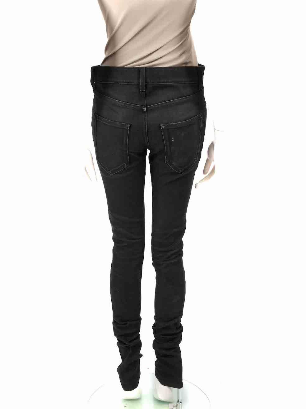 CONDITION is Very good. Minimal wear to the jeans is evident. Minimal wear to the front on the hemline, rear end pocket edges and bottom is seen with discolouration marks on this used Saint Laurent designer resale item.
 
 
 
 Details
 
 
 Black
 
