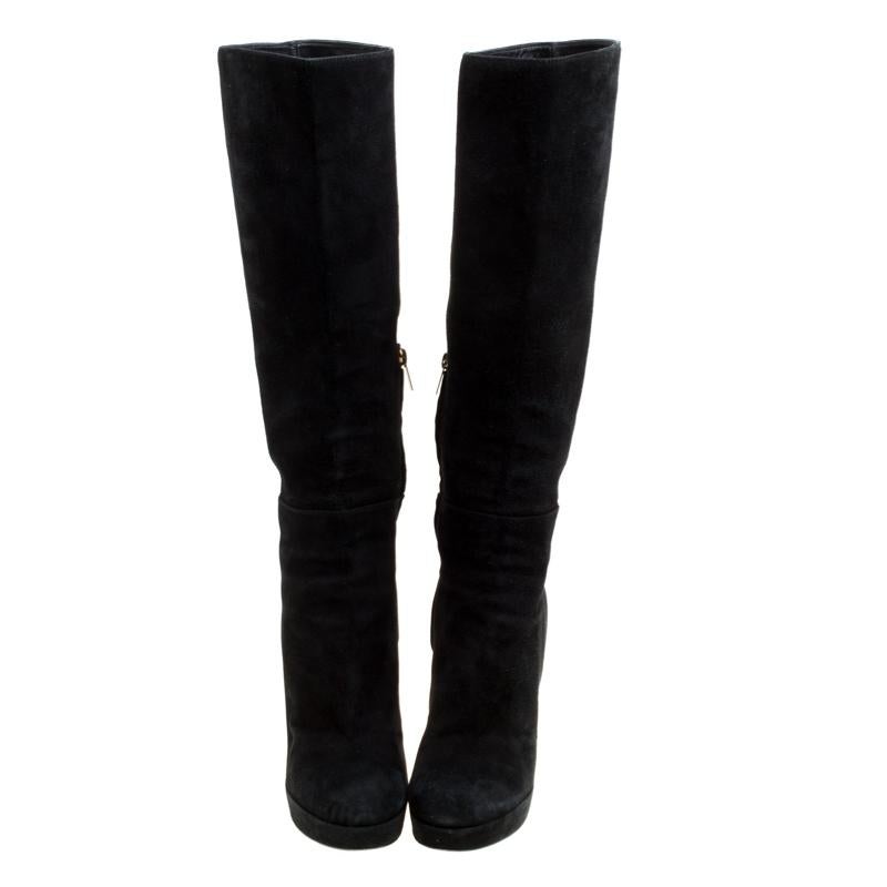 The search for those perfect boots ends with these gorgeous ones from Saint Laurent! These black boots have been crafted from suede and styled with round toes and side zippers. They come equipped with comfortable leather lined insoles, 12 cm block