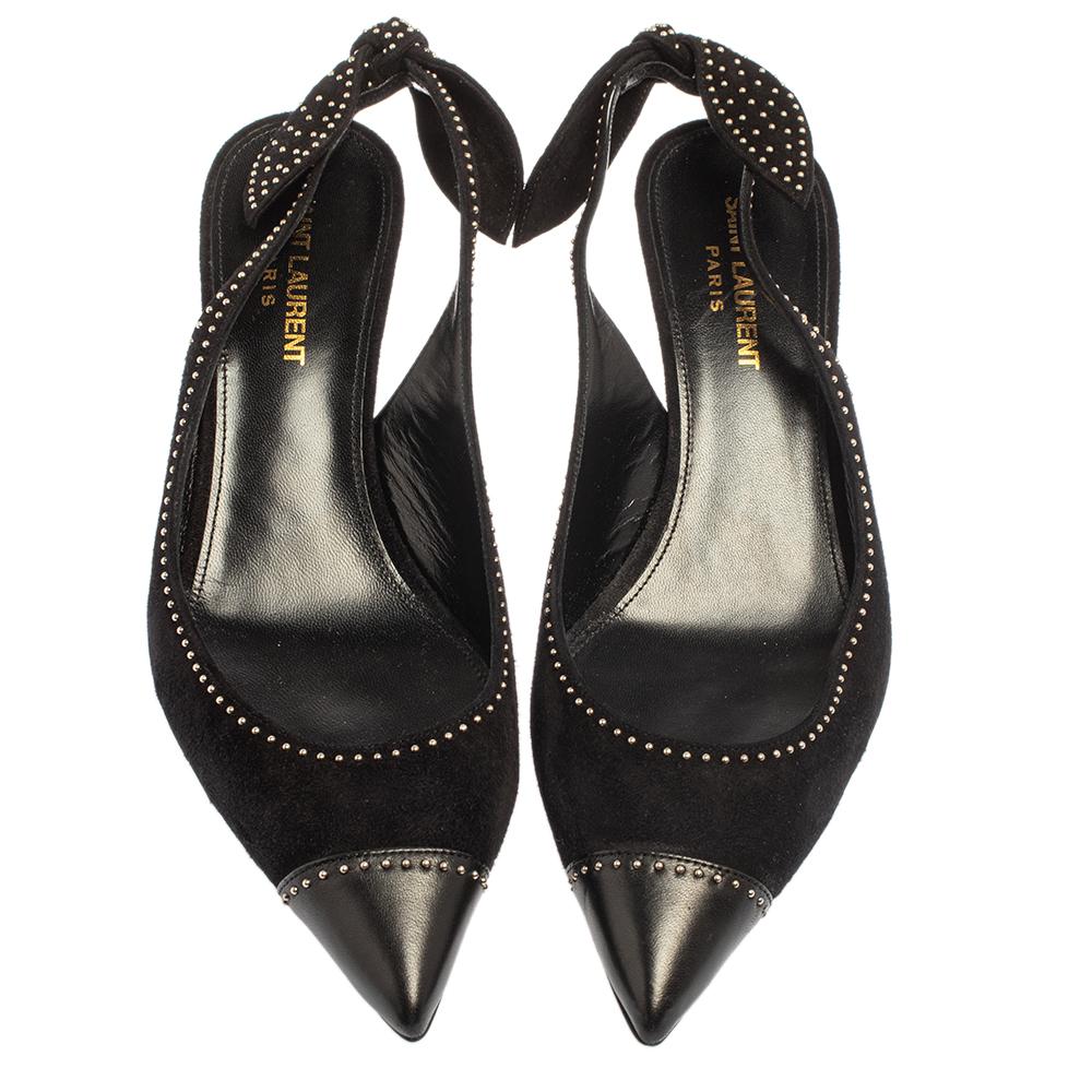Made from suede, these Charlotte pumps are a splendid example of luxury and class. A pair of stunning Saint Laurent pumps like this one is a closet must-have. These black beauties feature pointed toes, stud embellishments, slingbacks, and 6.5 cm