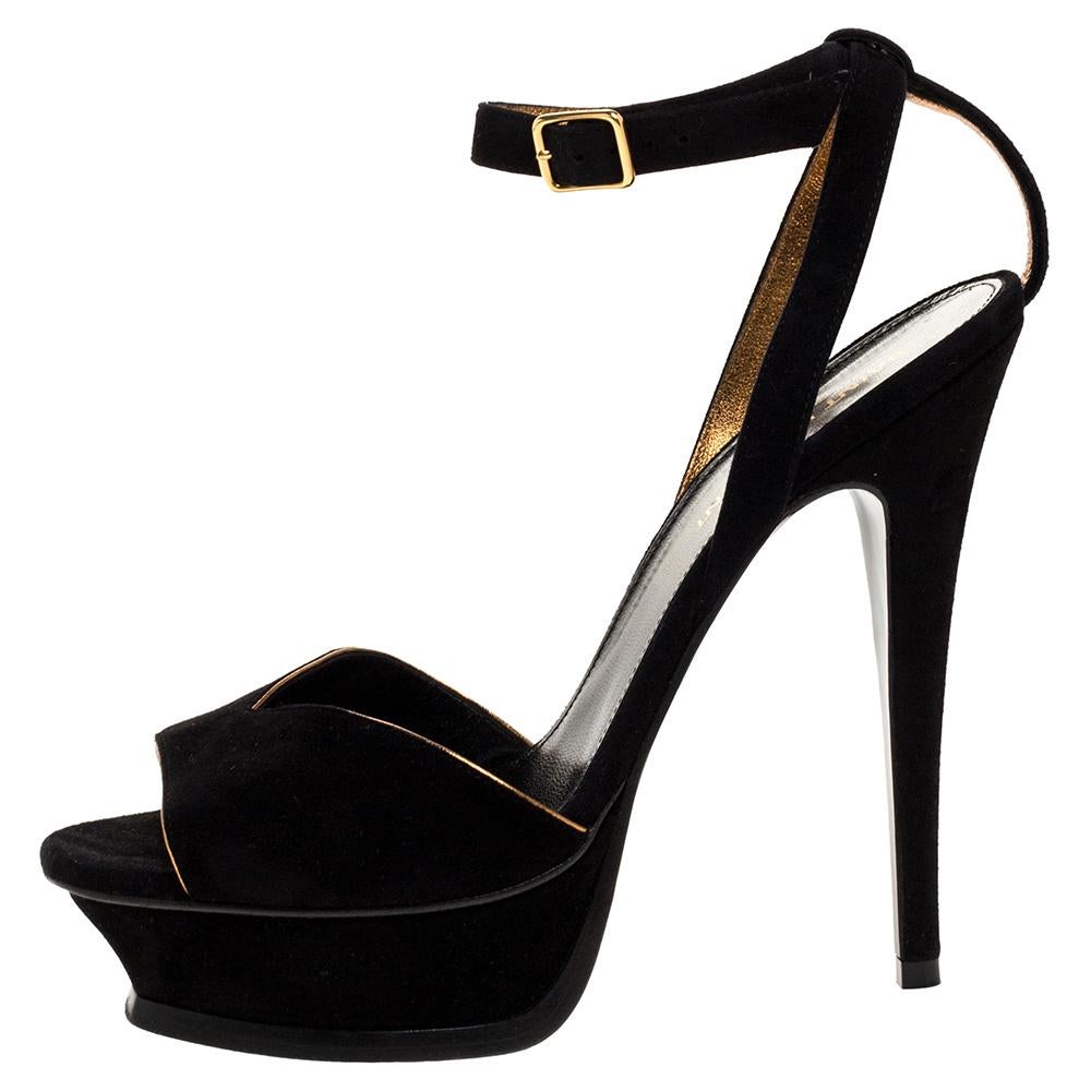 A perfect blend of comfort and style, these black sandals by Saint Laurent are just what you need for an evening out. They feature open toes and slim ankle straps with buckle fastening. They are made from suede and set on platforms and 13.5 cm