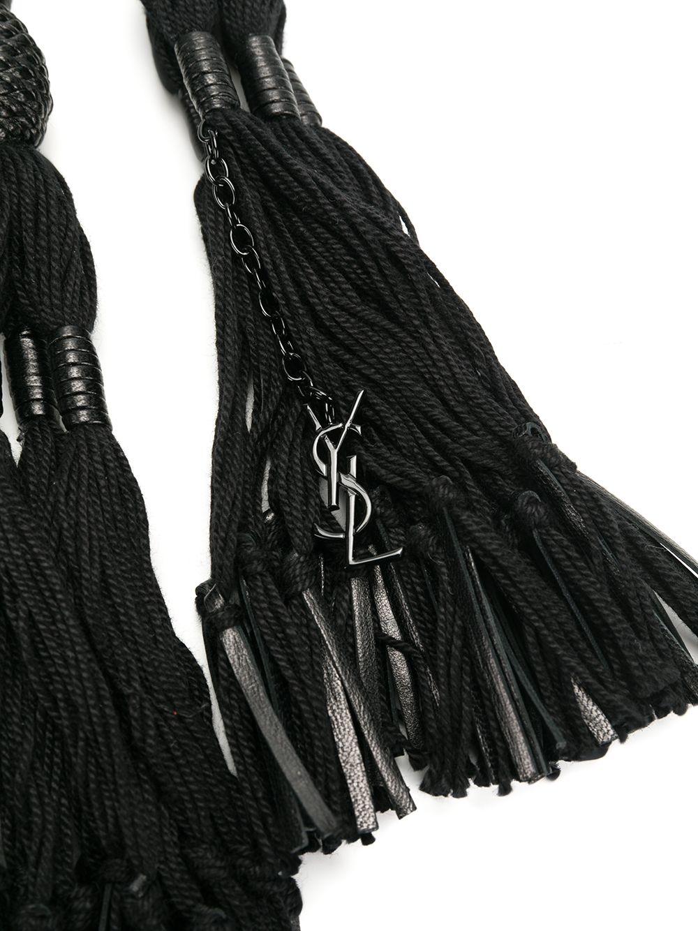 Saint Laurent Black Tassel Knot Cotton & Leather Rope Belt w/ YSL Charm

Saint Laurent's black rope belt is imbued with a 1970s craft-inspired feel. It features swishing tassels and a metal YSL logo charm, and secures via a slip-through fastening.