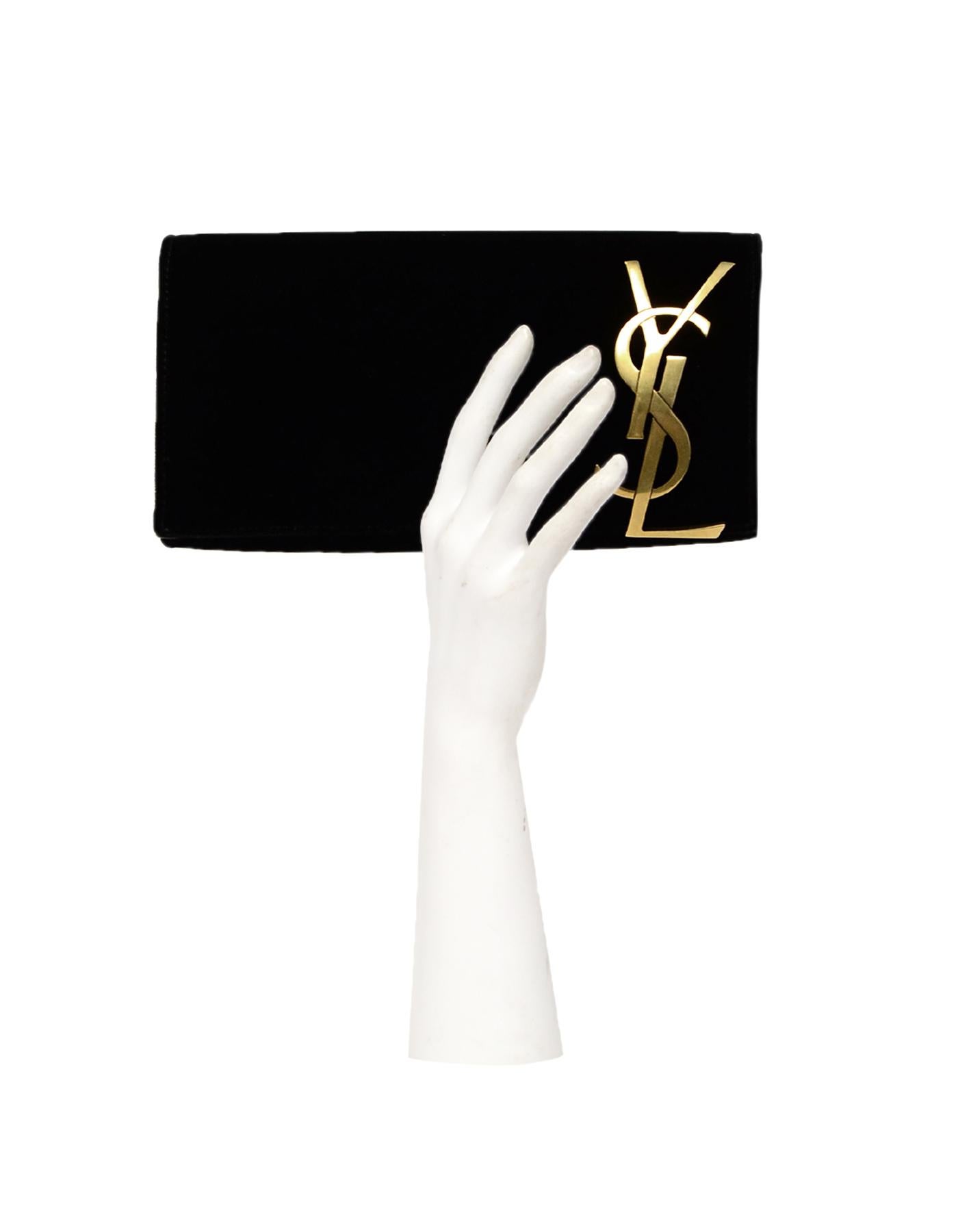 Saint Laurent Black Velvet Smoking Clutch Bag

Made In: Italy
Color: Black
Hardware: Goldtone hardware
Materials:  Velvet, metal
Lining: Black leather lining
Closure/Opening: Top flap with magnetic snap
Exterior Pockets: N/A
Interior Pockets: One