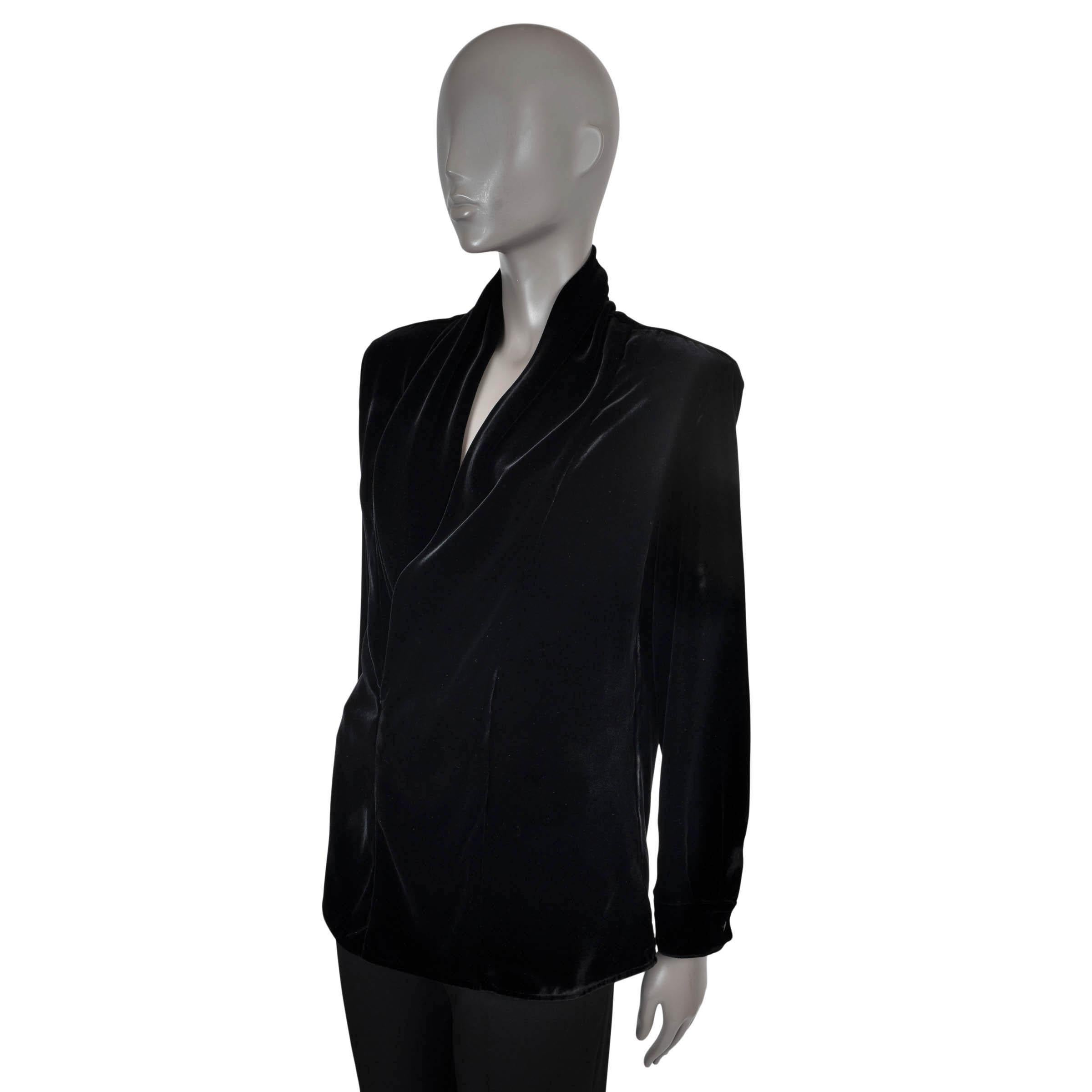 100% authentic Saint Laurent blouse in black velvet viscose (74%) and silk (26%). Features a plunging V-neck with a draped collar and buttoned cuffs. Unlined. Has been worn and is in excellent condition.

2022