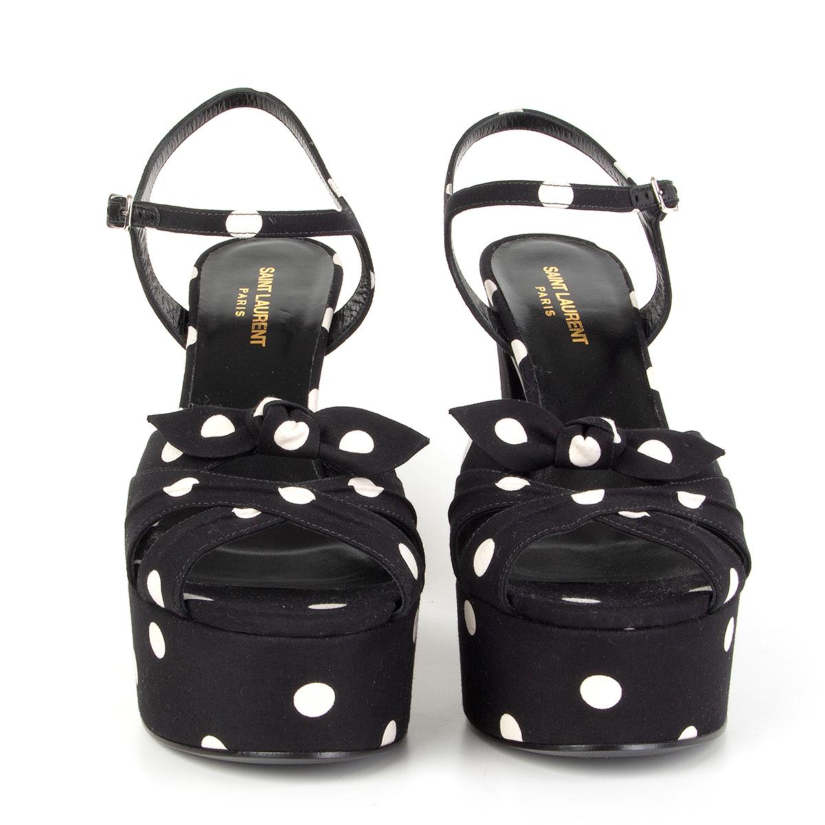 100% authentic Saint Laurent 'Candy' platform sandals in black and off-white polka dot cotton and bow detail. Brand new. 

Measurements
Imprinted Size	40.5
Shoe Size	40.5
Inside Sole	26cm (10.1in)
Width	8cm (3.1in)
Heel	14cm (5.5in)
Platform:	5cm