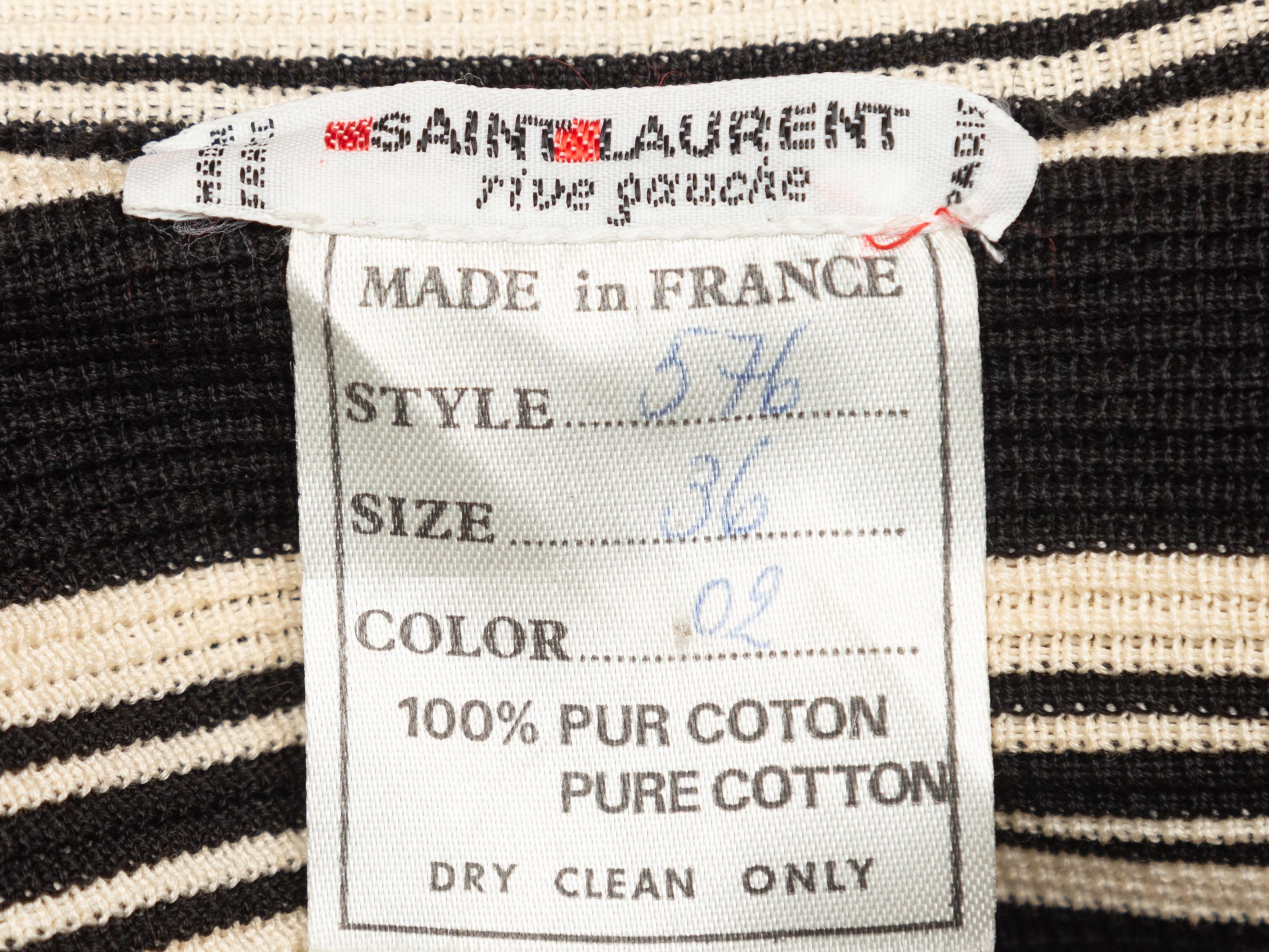 Product details: Vintage black and white striped knit blazer by Saint Laurent. Notched lapel. Four pockets. Button closures at front. Designer size 36. 34