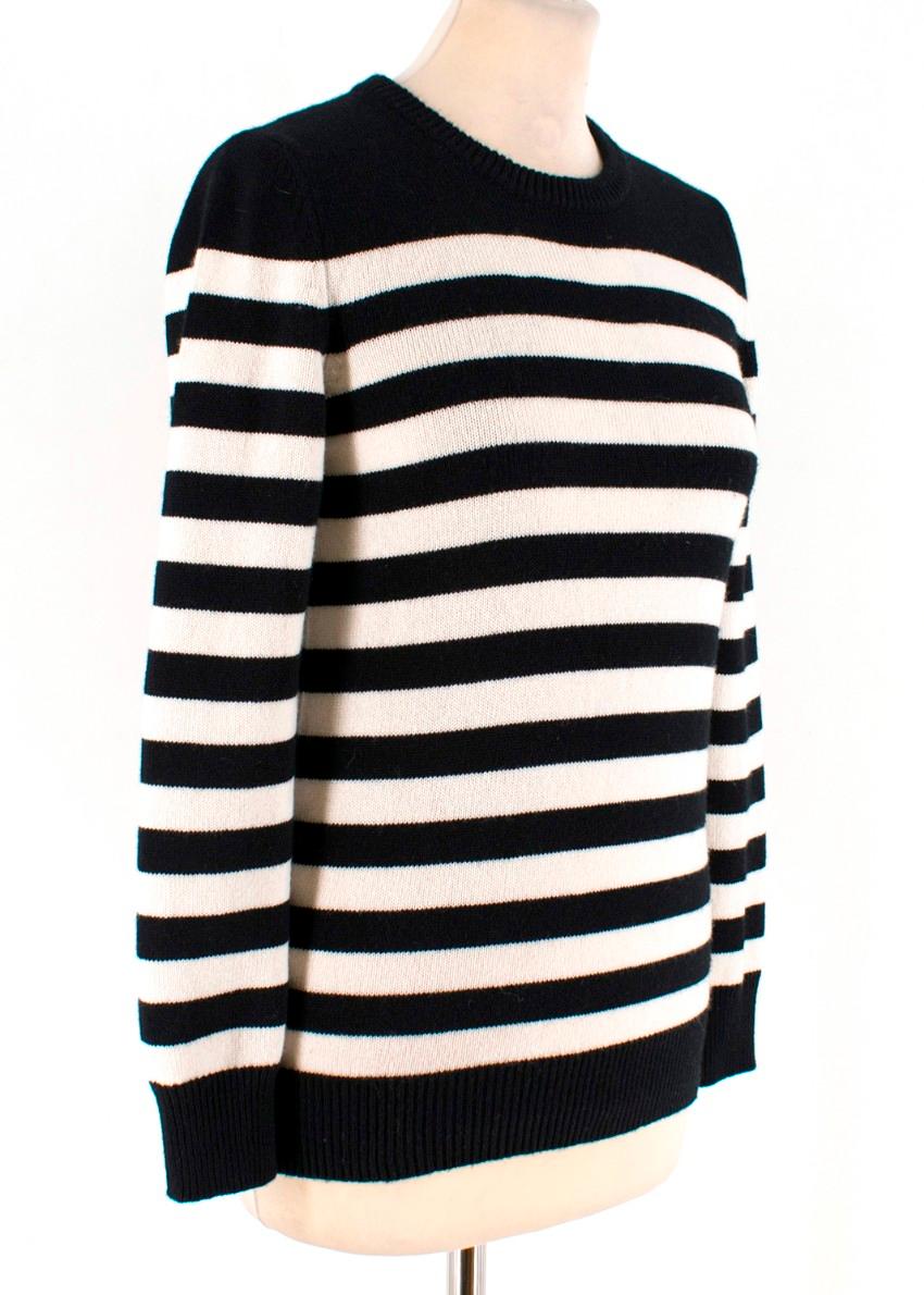 Saint Laurent Black & White Striped Cashmere Sweater.

- This version is knitted from fine black and white cashmere and has 
- Ribbed neck, cuffs & hem 
- Black colour with white stripes over the top
- Long sleeved

SIZE UK/8 - US/4

This item has