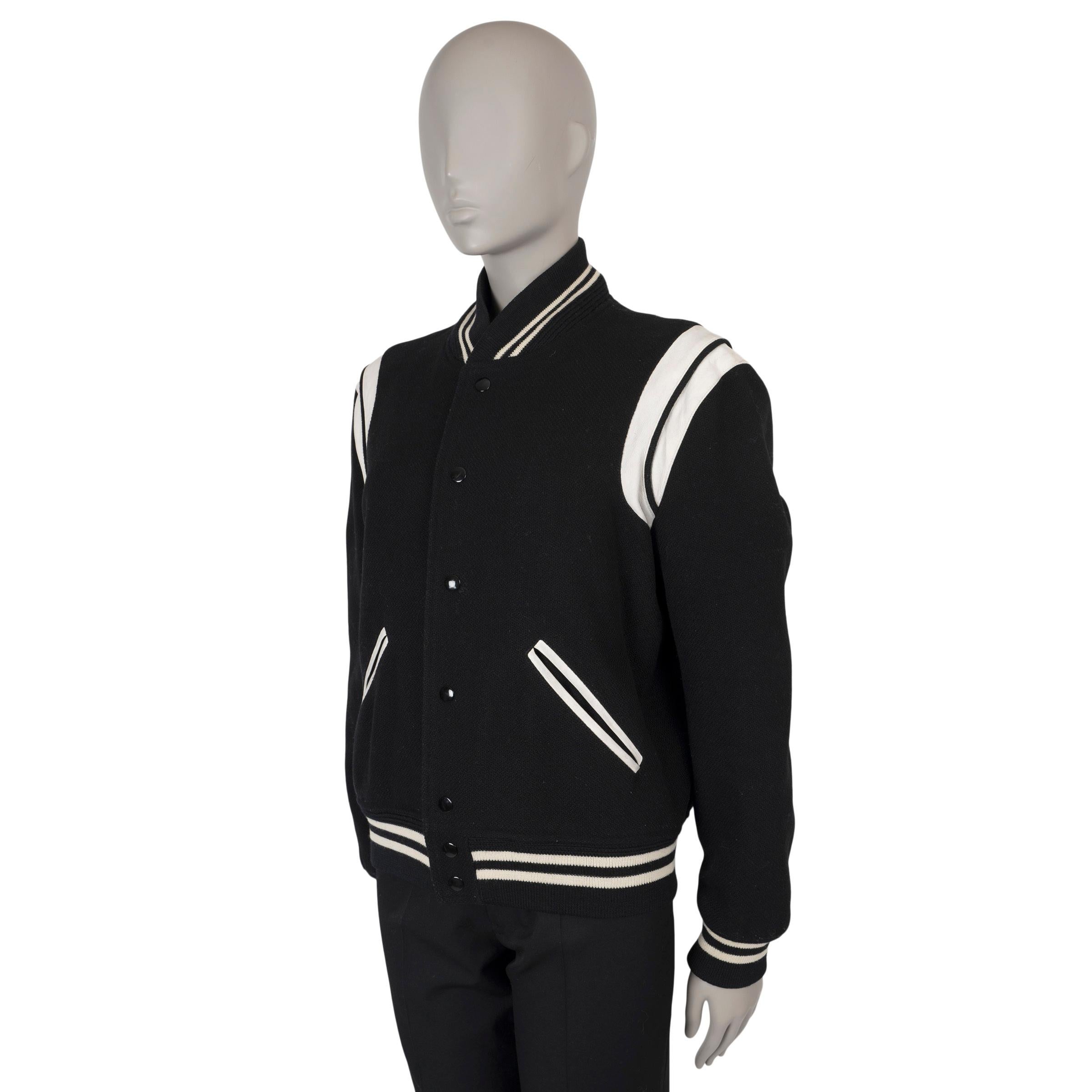 This 100% authentic Saint Laurent Teddy bomber jacket in black is crafted from a luxurious blend of wool (88%), polyamide (10%), and silk (2%). An iconic piece, it features white leather trims at the shoulder seams, black and white striped rib-knit