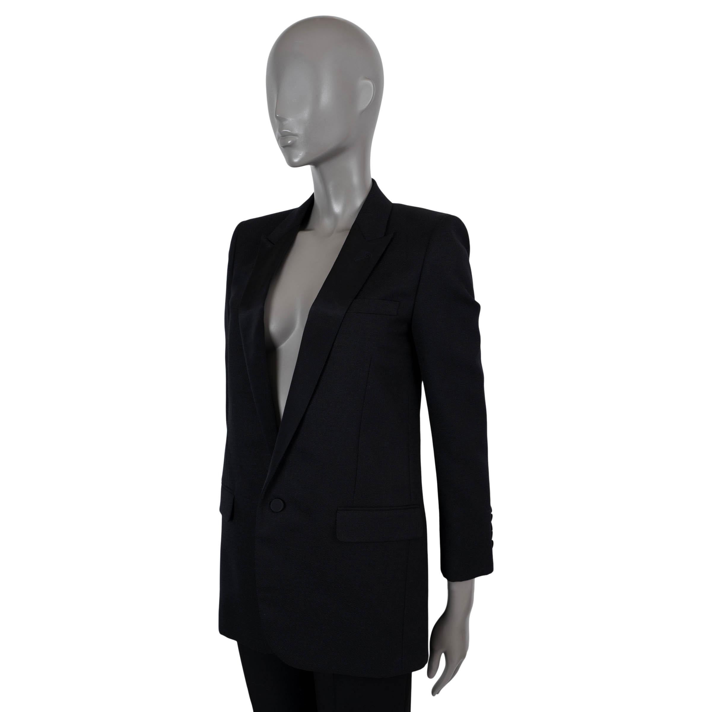 100% authentic Saint Laurent classic tuxedo blazer in black Grain de Poudre wool (100%). Features peak lapels in grosgrain and two flap pockets at the waist. Closes with a single button on the front and is lined in silk (100%). Has been worn and is