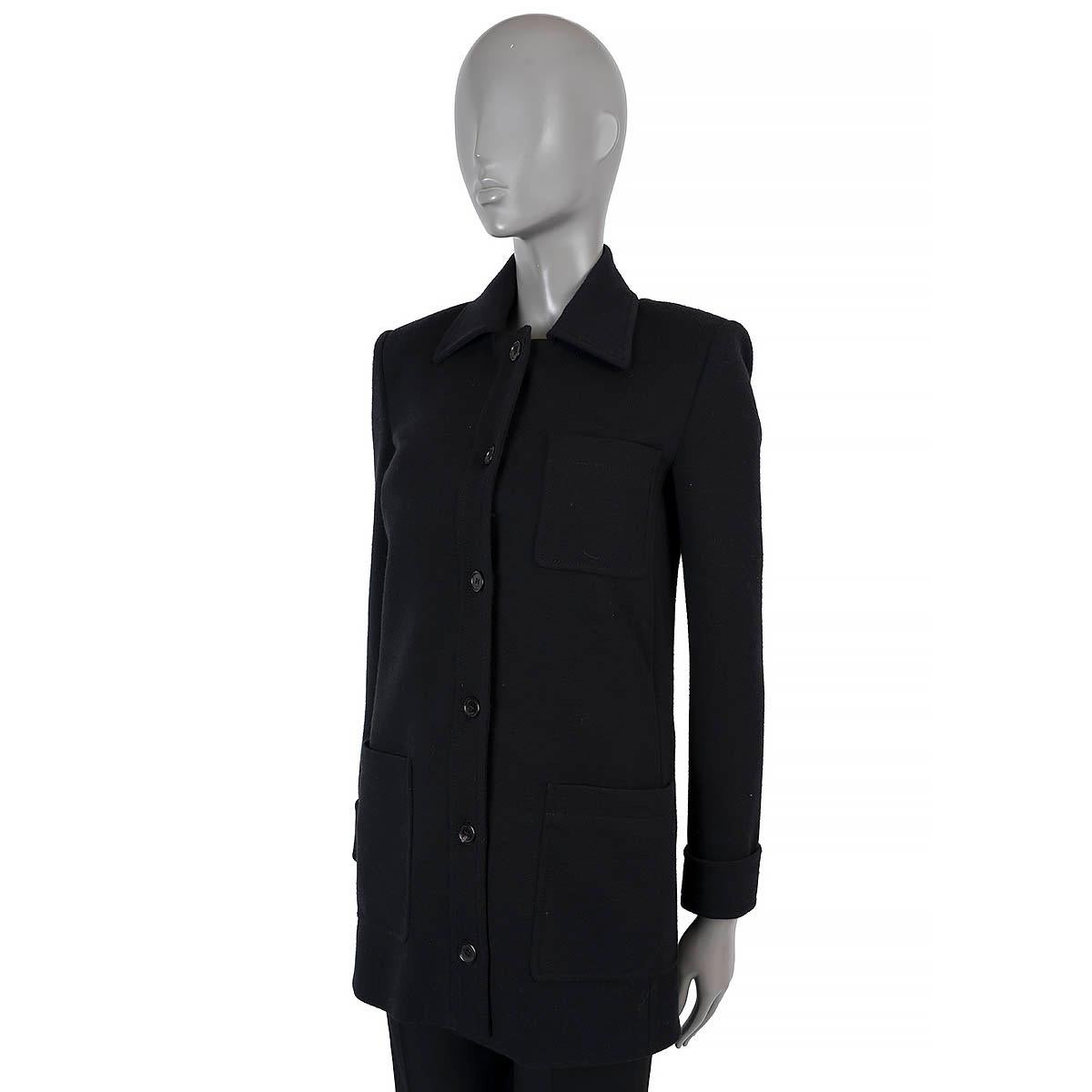 100% authentic Saint Lauren fitted jersey coat in black wool (80%) and polyamide (20%). Featyres twi patch pockets at the waist and one at the chest. Opens with six buttons on the front. Lined in silk (95%) and elastane (5%). Has been worn and is in
