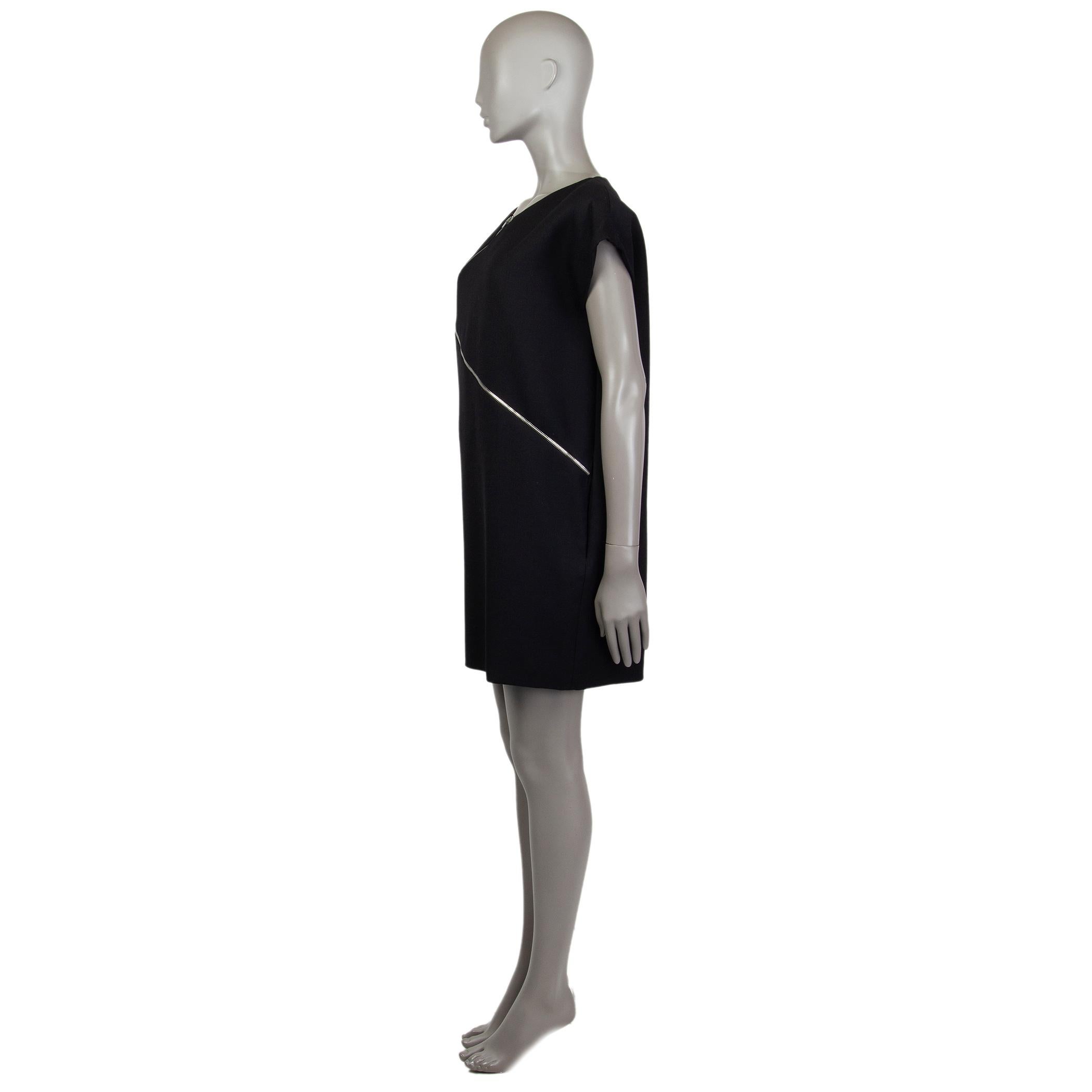 Saint Laurent cap-sleeve shift dress in black wool (100%). With diagonal zipper details on the front and two slit pockets on the sides. Closes with hook and invisible zipper on the back. Lined in black silk (100%). Has been worn and is in excellent