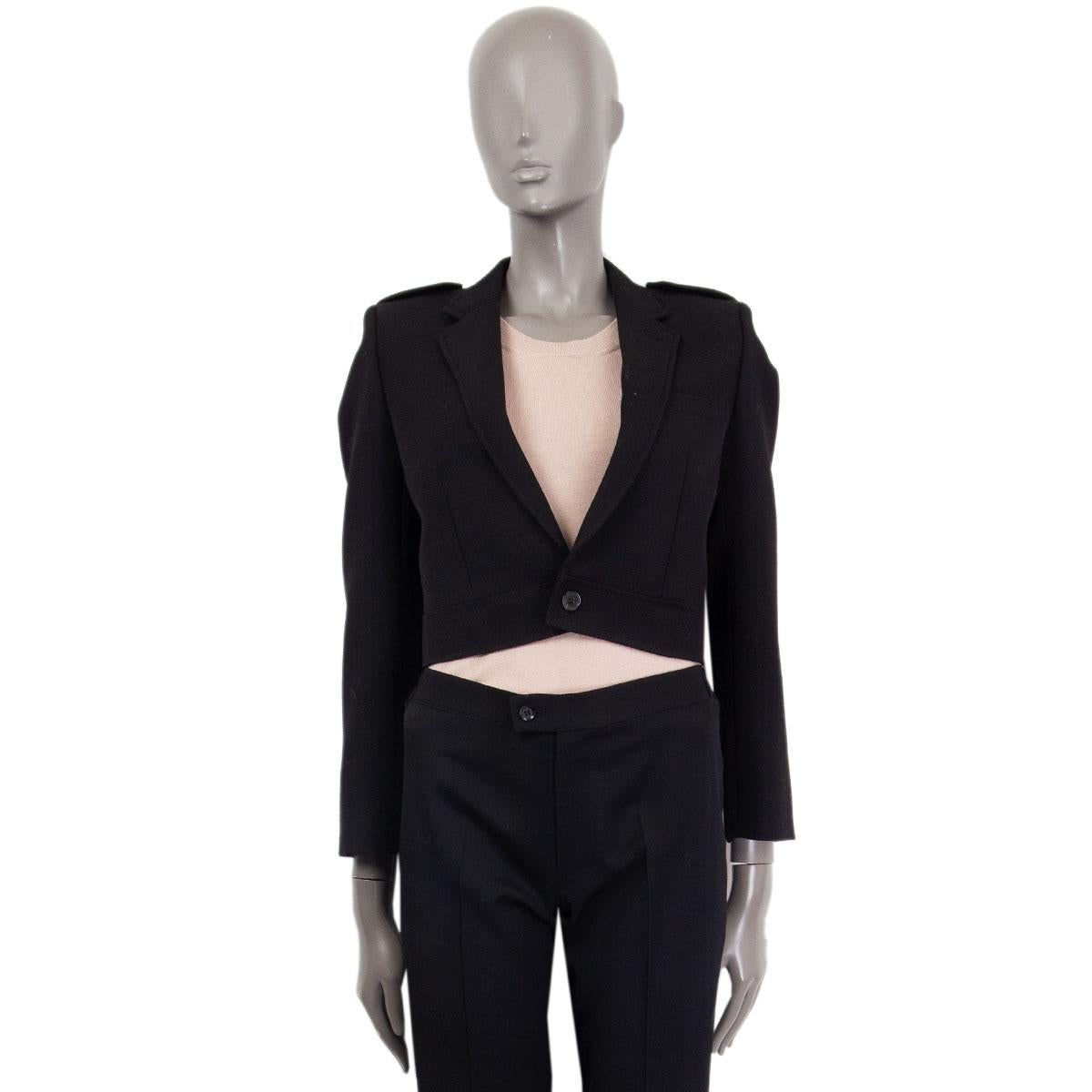 Saint Laurent cropped jacket in black wool (100%) with a notch collar, epaulettes, one front chest pocket and decorative buttoned cuffs. Closes on the front with a single button. Lined in black silk (100%). Has been worn and is in excellent