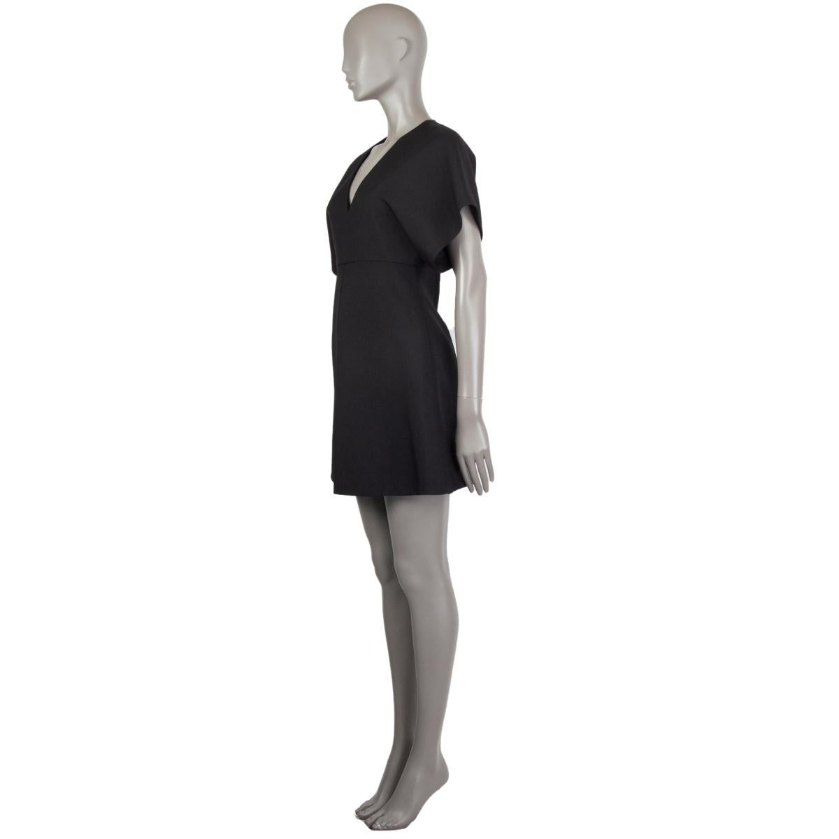Saint Laurent mini dress in black virgin wool (100%). With kimono sleeves, v neck, empire waist, and box pleat on the front. Closes with invisible zipper on the back. Lined in black silk (100%). Has been worn and is in excellent condition. 

Tag