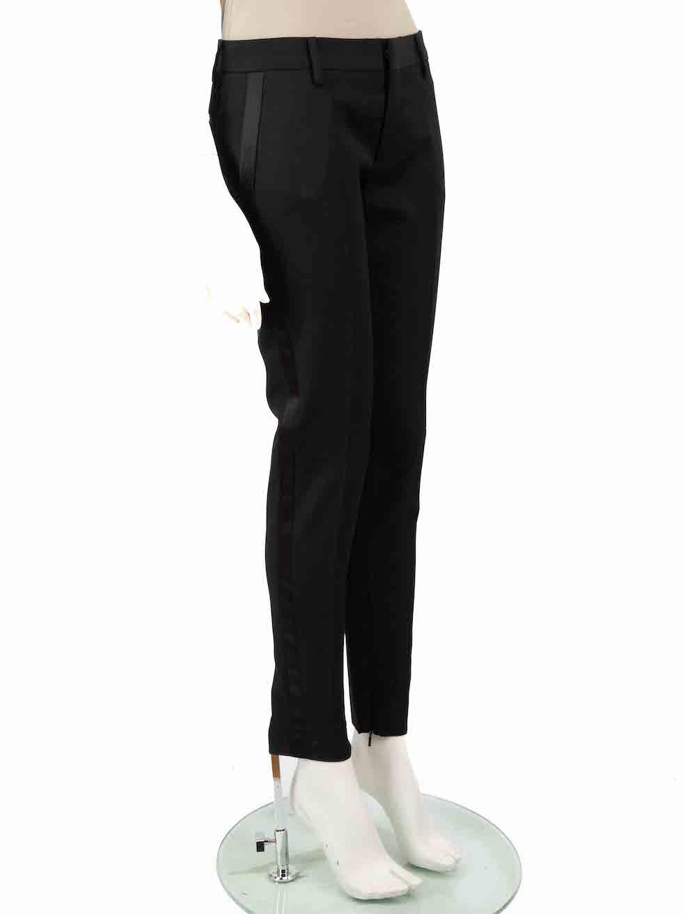 CONDITION is Very good. Hardly any visible wear to trousers is evident on this used Saint Laurent designer resale item.
 
 
 
 Details
 
 
 Black
 
 Wool
 
 Trousers
 
 Slim fit
 
 Satin side tape detail
 
 Mid rise
 
 Zipped cuffs
 
 2x Side