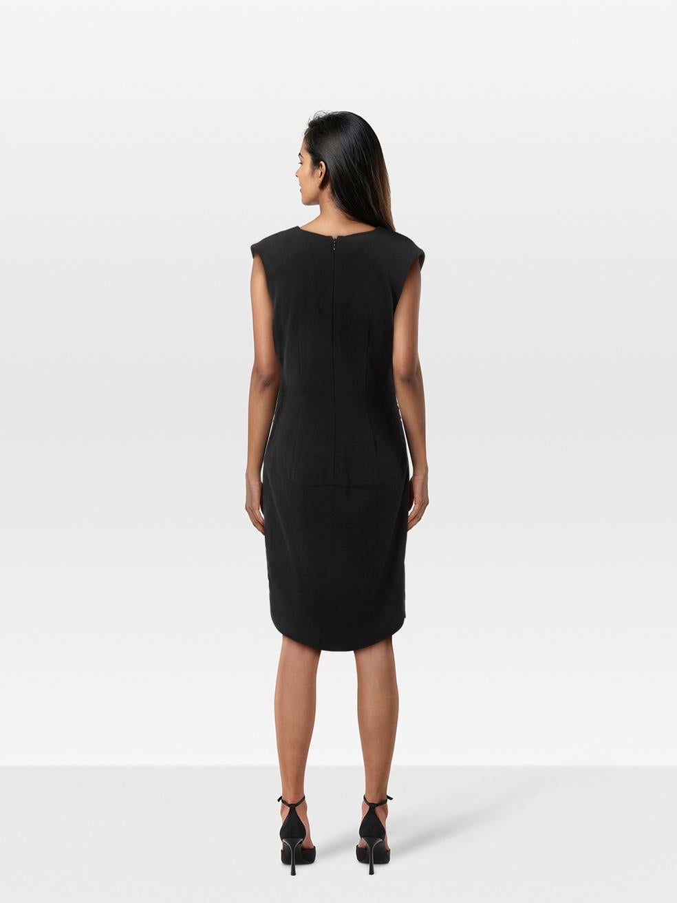 CONDITION is Very good. Minimal wear to the dress is evident. Pluck to the weave on the front right below the bust on this used Saint Laurent designer resale item.
 
 Details
 
 
 Black 
 
 Wool
 
 Dress
 
 Knee length
 
 V neck
 
 Side ruched