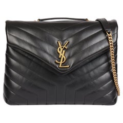 SAINT LAURENT Cuir de veau noir matelassé Y Moyen Loulou
