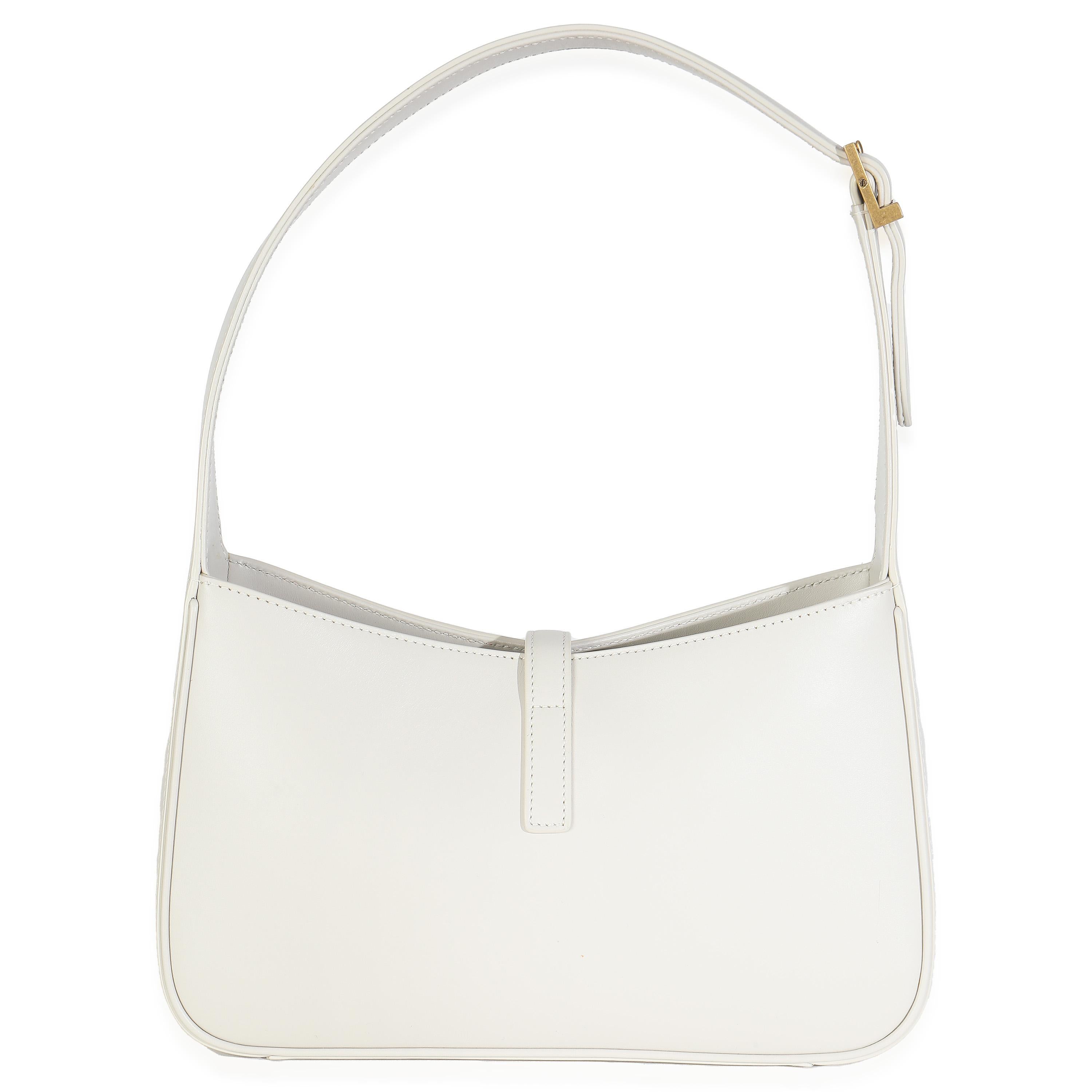 Listing Title: Saint Laurent Blanc Vintage Smooth Calfskin Medium Le 5 A 7 Hobo
SKU: 147868
MSRP: 2500.00 USD
Condition: Pre-owned 
Condition Description: Rive Gauche refers to the southern bank of the river Seine, otherwise known as the Left Bank