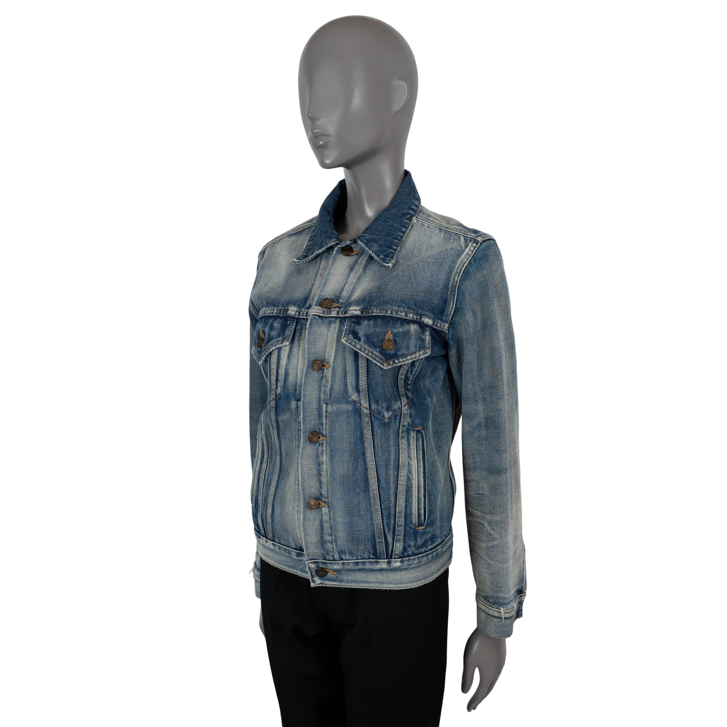 100% authentic Saint Laurent distressed denim jacket in acid washed blue cotton (100%). Features classic cut with silver-tone metal studs on the back, point collar, flap chest pockets, welt pockets at the waist and adjustable button tabs at the back