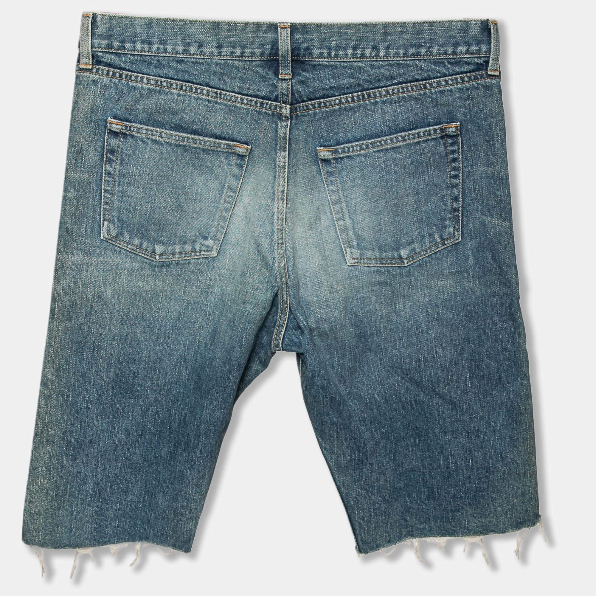These Capri shorts from Saint Laurent are a closet essential. They are tailored from blue distressed denim fabric and feature a buttoned closure on the front. These shorts accommodate five external pockets and are great for casual outings.

