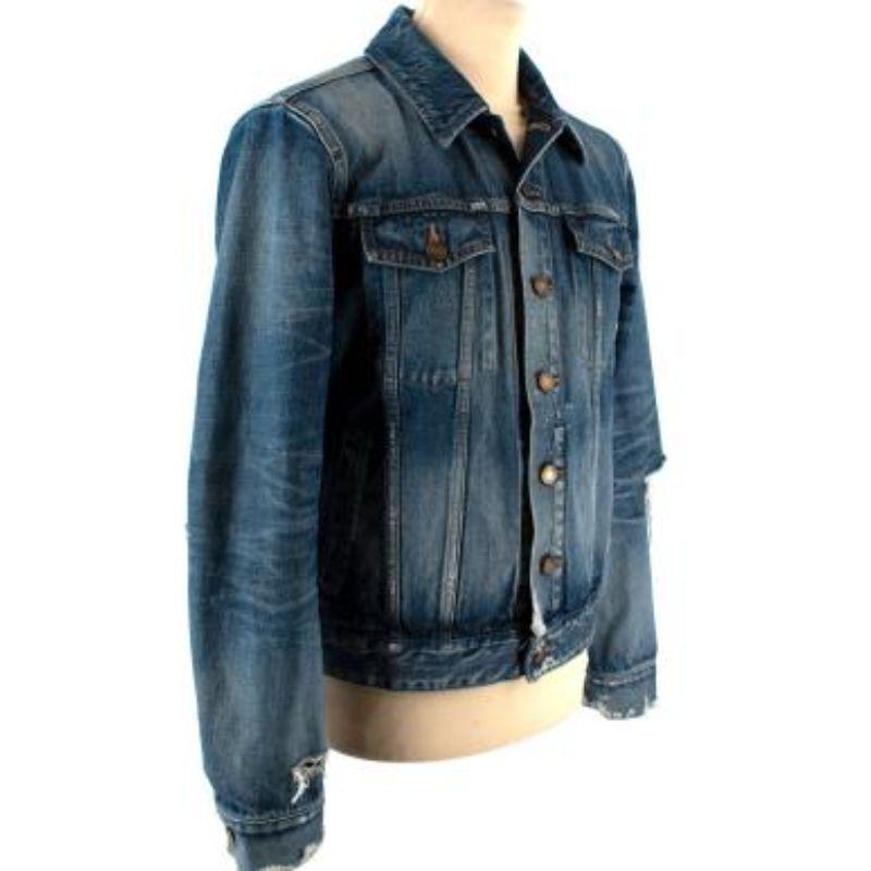 Saint Laurent Blue Distressed Denim Jacket

- Button fastening
- Distressed details throughout
- Two buttoned chest pockets with flap
- Two waist pockets
- Lapels

Material
Cotton

Made in Japan

PLEASE NOTE, THESE ITEMS ARE PRE-OWNED AND MAY SHOW