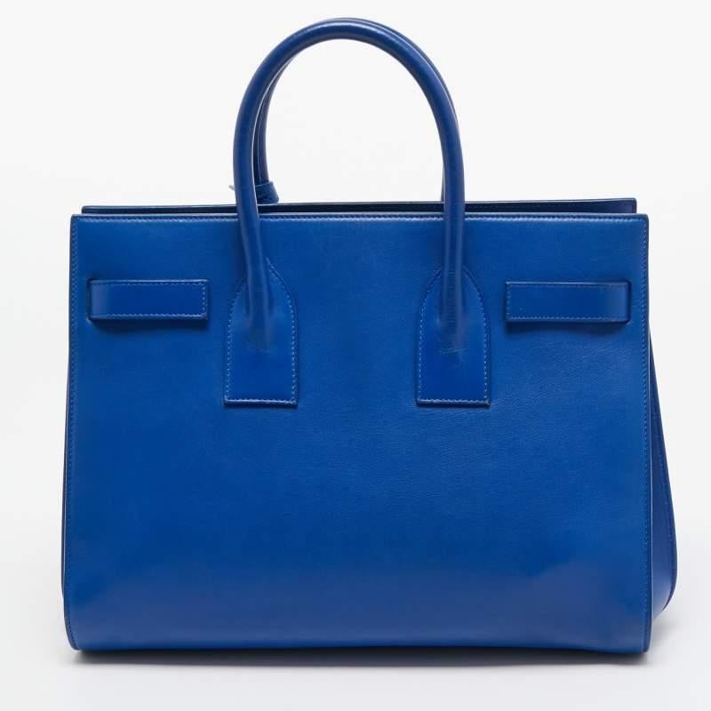 This alluring tote bag for women has been designed to assist you on any day. Convenient to carry and fashionably designed, the YSL tote is cut with skill and sewn into a classy shape. It is well-equipped to be a reliable accessory.

Includes: