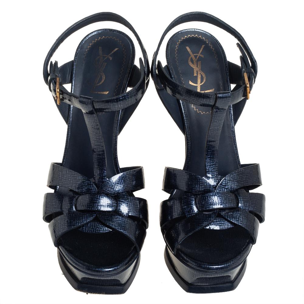 One of the most sought-after designs from Saint Laurent is their Tribute sandals. They are such a craze amongst fashionistas around the world, and it is time you own one yourself. These blue ones are designed with patent leather straps, ankle