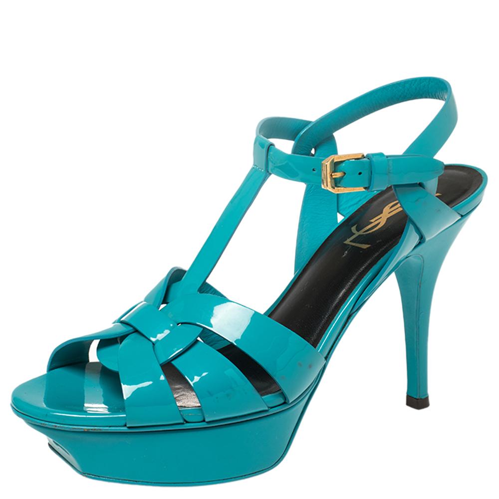 One of the most sought-after designs from Saint Laurent is their Tribute sandals. They are such a craze amongst fashionistas around the world, and it is time you own one yourself. These blue-hued ones are designed with glossy patent leather into a