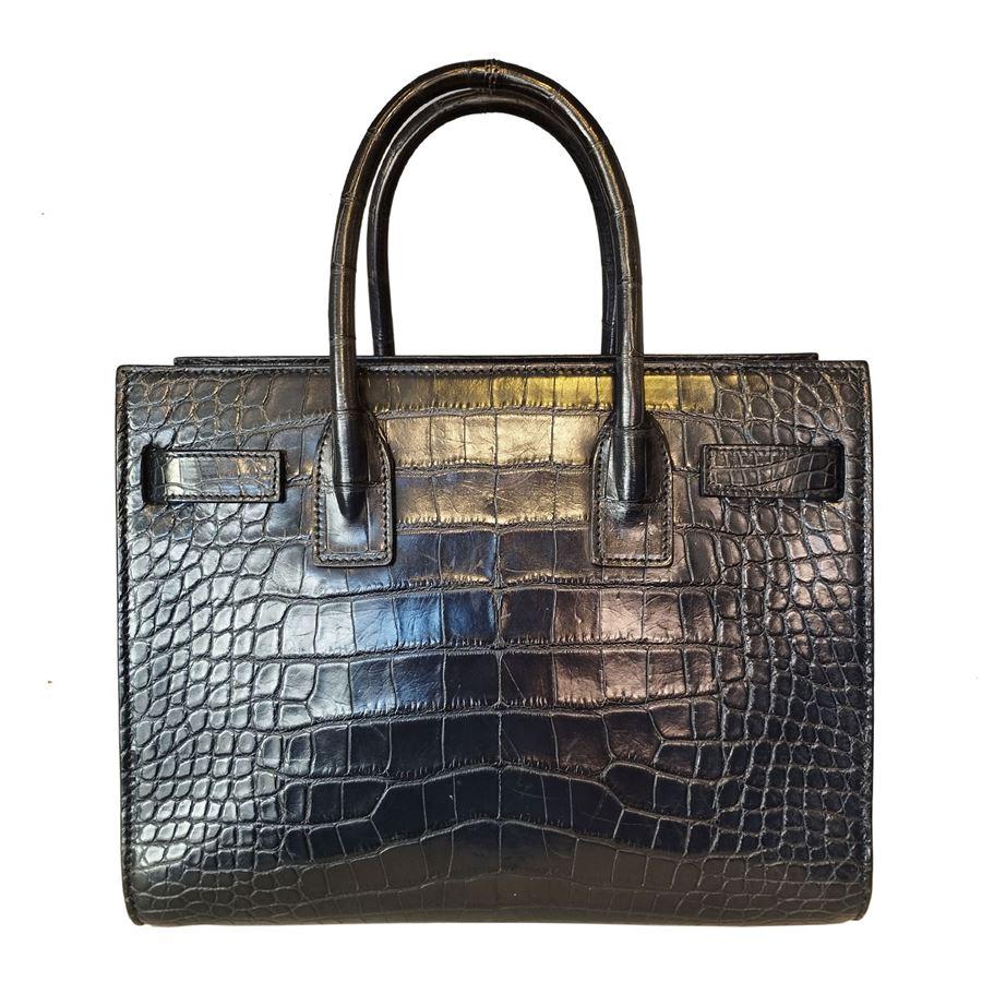 Super rare, beautiful and luxurious Saint Laurent Sac de Jour Baby Real Mississippi alligator 
Night blue color 
Two handles 
Can be carried crossbody too (removable belt) 
Keys and locker 
Two internal compartments (divided by large zipped pocket)
